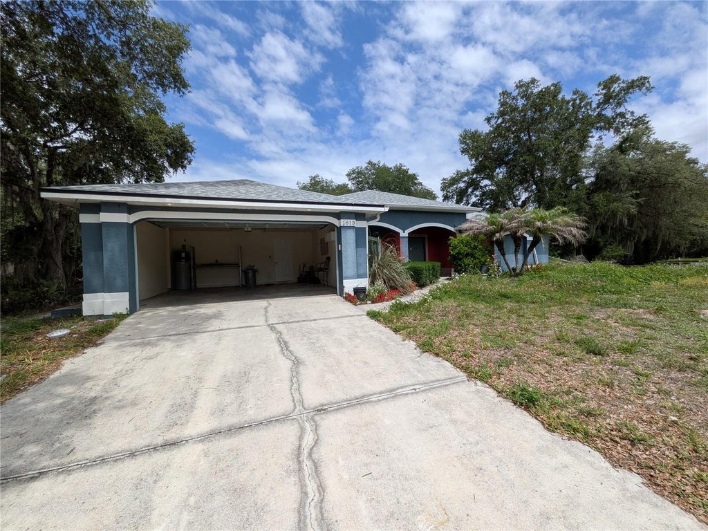 Photo of 1813 Jackson Avenue, Lehigh Acres, FL 33972 (MLS # TB8516829)