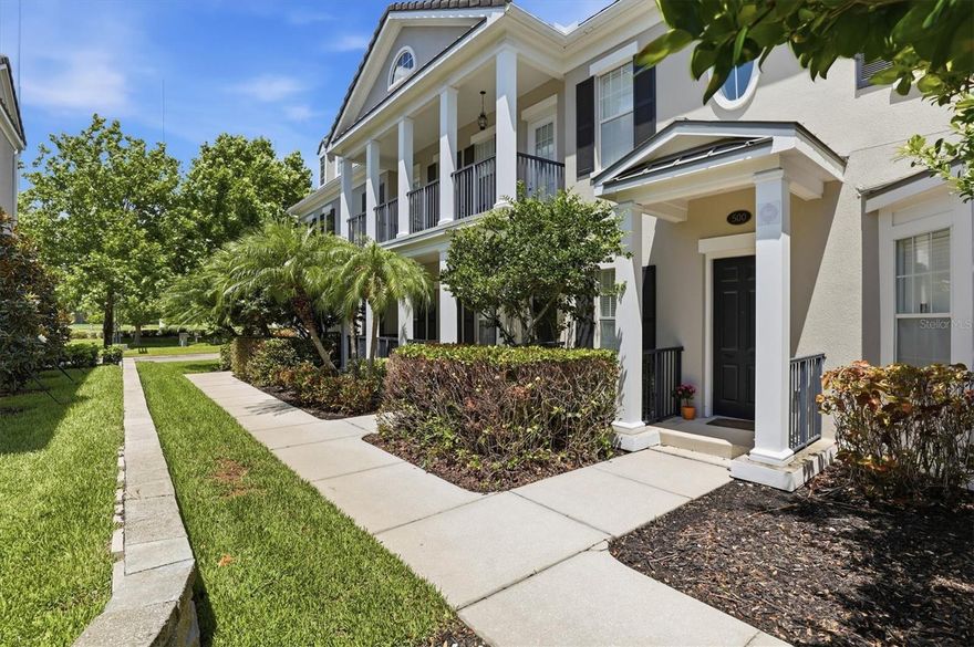Nestled within the prestigious Echelon City Center at Carillon Park, this immaculate, maintenance-free townhome offers 3,660 sq ft of refined living with the flow and presence of a single-family residence. Enter beneath soaring coffered ceilings to an open, light-filled floorplan anchored by a fireplace and grand living and dining rooms ideal for entertaining family and friends. The chef’s kitchen features a generous island, two-tone wood cabinetry and newer stainless appliances, while wood-look ceramic tile spans the entire first level, including the butler’s pantry and Primary Suite. The sumptuous Primary Suite features two expansive walk-in closets and a spa-like bath with upgraded countertop, soaking tub and glass-enclosed shower. French doors open to a private courtyard for serene outdoor living. An elegant staircase ascends to a large family-room loft, a Junior en-suite, an additional bedroom, full bathroom and a French Door Juliette balcony.  Rear stairs from the garage access a 500-sf studio with kitchenette, full bath and closets—perfect for multi-generational living. Thoughtful recent investments include 34 impact-rated SoftLite windows and French doors (2023), new flat roof (2023), HVAC (2021), and water heater (2025). The oversized two-car garage features a premium floor coating and whole-house water conditioner. Residents enjoy a luxury pool, clubhouse with kitchen, fitness center, miles of trails and lakeside boardwalk, plus proximity to Topgolf, shopping, dining, I-275, Tampa, St. Pete, the Gulf beaches and two international airports. HOA fees of $565 cover exterior maintenance.