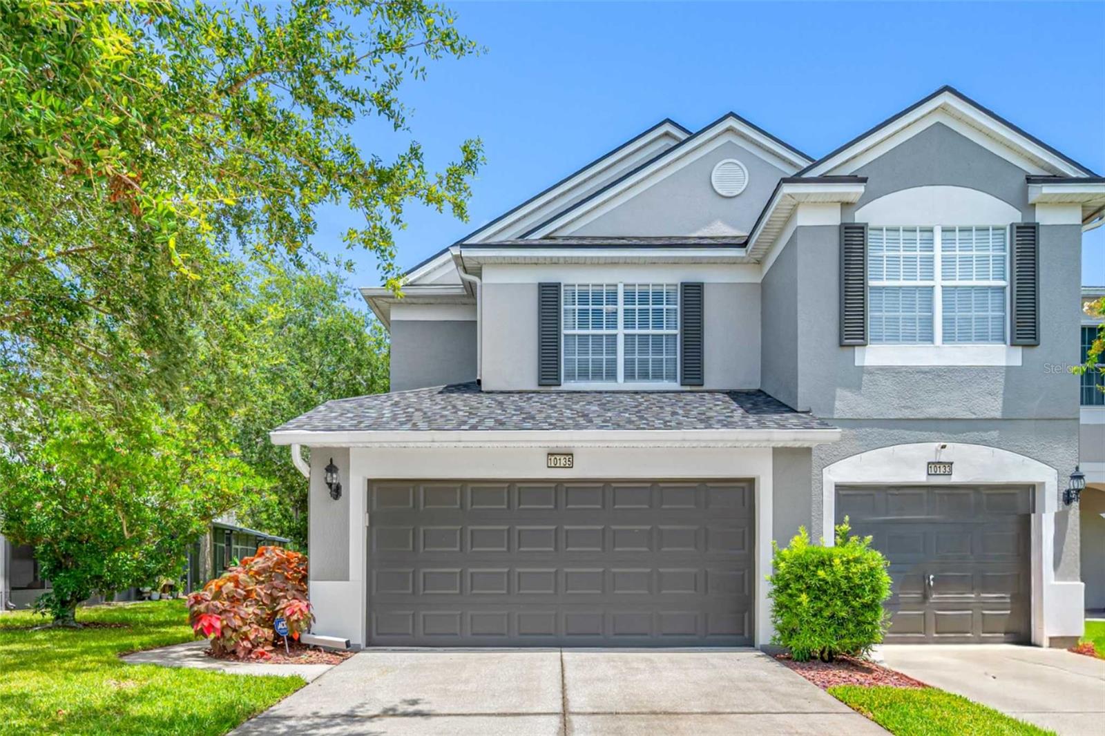This rare corner-unit townhome is a standout in the gated community of Westpark Preserve. Featuring 3 bedrooms, 2.5 bathrooms, and a spacious 2-car garage, this well-maintained home combines style, comfort, and convenience. As an end unit, it enjoys extra windows throughout, filling the space with abundant natural light and enhancing the open, airy atmosphere.The kitchen and primary bathroom have been upgraded with beautiful, thick granite countertops and sleek undermount sinks, offering a touch of luxury to everyday living. Additional recent improvements include brand new stainless steel Whirlpool appliances, a newer Lennox AC system, a recently replaced water heater, and fresh interior paint throughout. All wet areas feature durable tile flooring, and ceiling fans have been installed in every room for year-round comfort. Rich wood flooring accents the main living and dining areas, and sliding glass doors off the family room lead to a private screened-in patio overlooking peaceful wooded greenery—perfect for relaxing or entertaining. Upstairs, three generously sized bedrooms provide flexible space for family, guests, or a home office. Westpark Preserve is a gated, manicured community offering residents access to a gorgeous pool and recreational area. Ideally located near the Veterans Expressway and Linebaugh Avenue, you'll enjoy quick access to shopping, dining, and all that Tampa Bay has to offer!