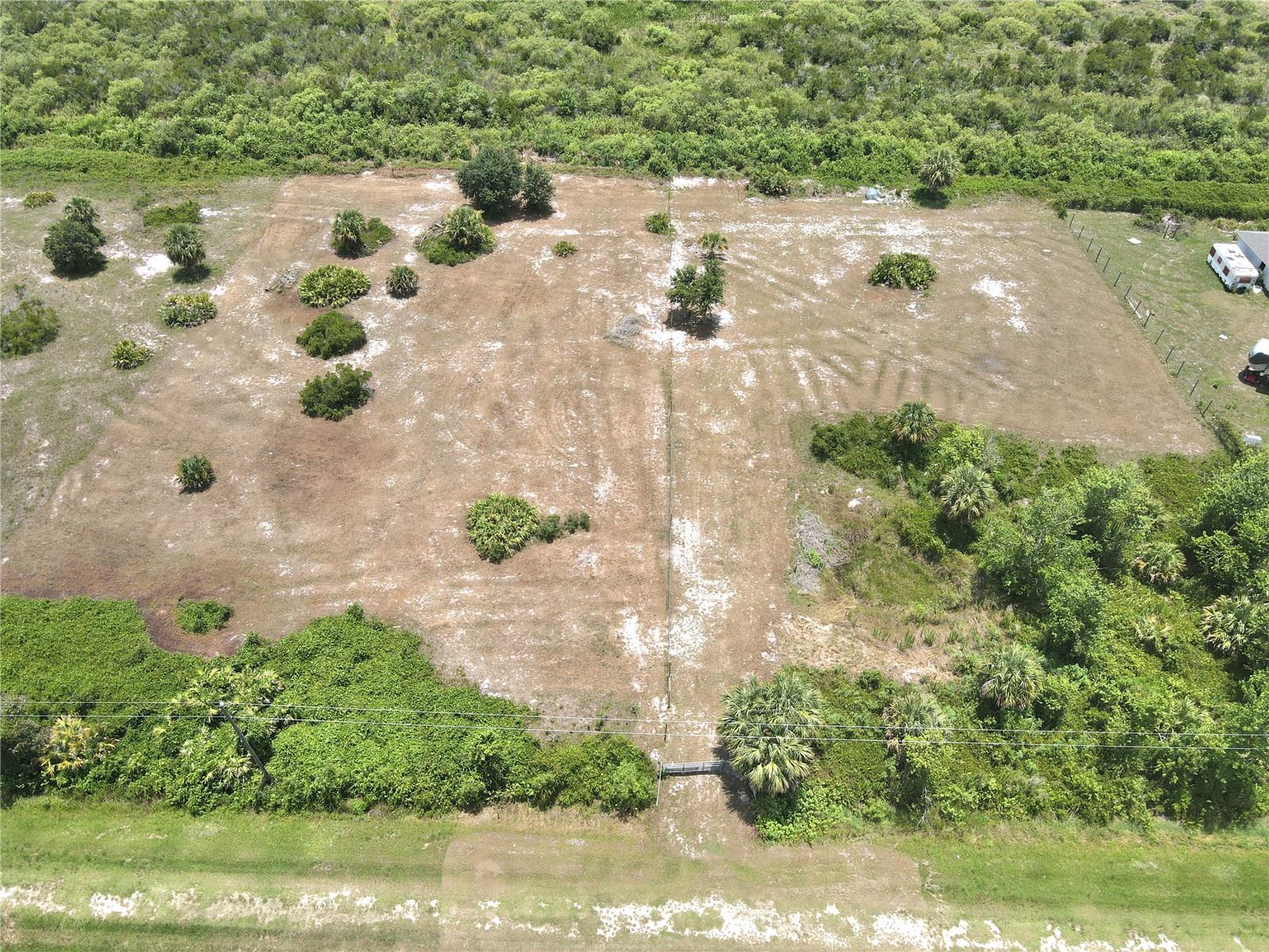 Discover your perfect canvas for country living on this pristine vacant lot in Okeechobee. This high and dry property comes completely cleared and ready for you to build your dream home. Enjoy the peace and tranquility of a quiet street while having the convenience of being just a short distance from everyday necessities like Publix Super Market and Walmart Supercenter.
The property features practical improvements including a well, culvert, and established driveway, saving you valuable time and resources during your building process. Already partially fenced, this lot offers immediate privacy and security for your future home.
Embrace the spaciousness of the property with room for various outdoor activities or creating the outdoor setting you desire. The rural setting provides a refreshing escape from city life while maintaining accessibility to modern conveniences. Your vision starts here – on solid ground with endless possibilities!
All measurements are approximate.
