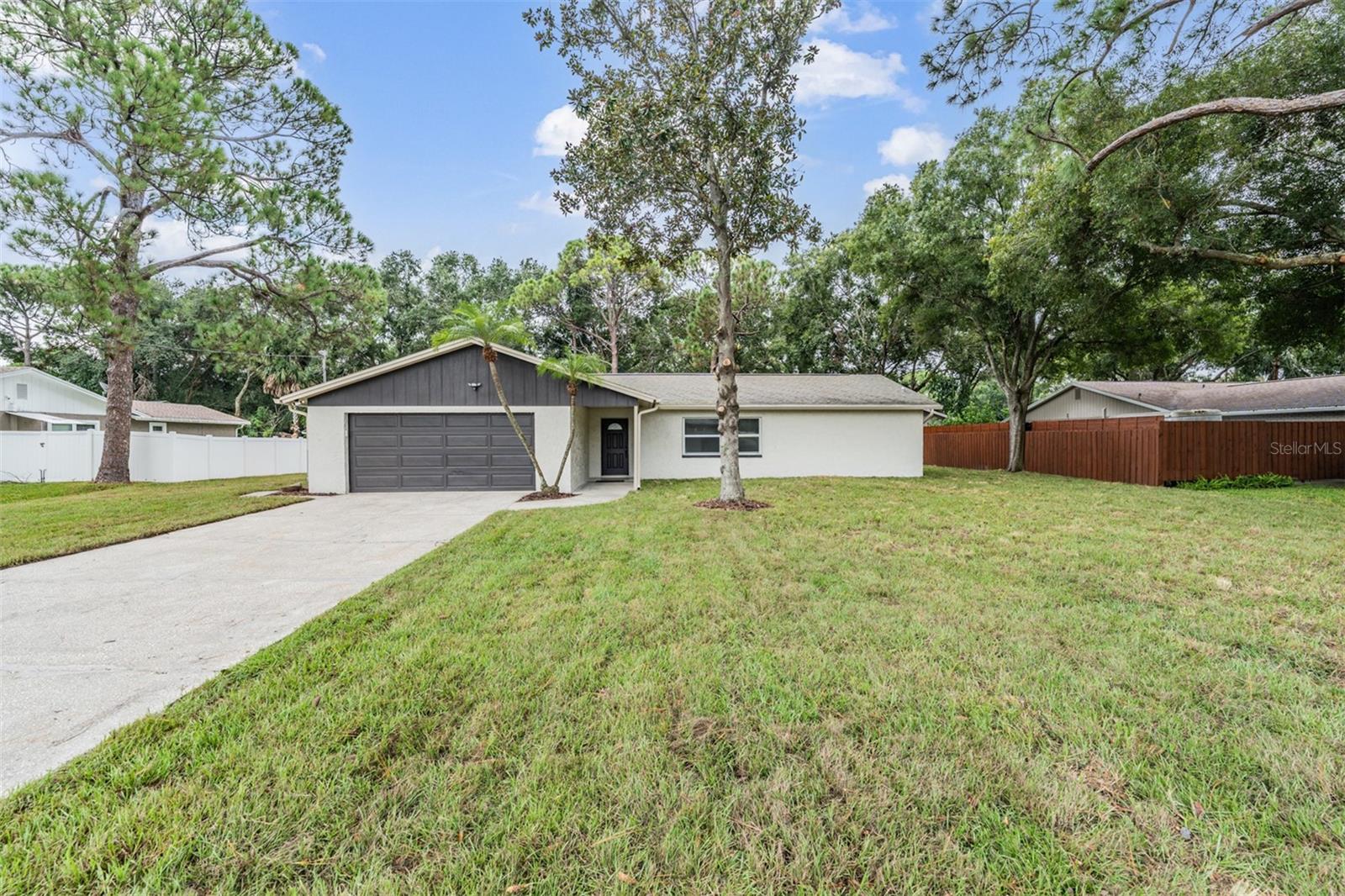 Opportunity to live in a quiet neighborhood with a unique oversized lot, rare to find in Tampa! Welcome to this stunning, newly remodeled 3 bed l 2 bath residency conveniently located in Byars Heights, a prime location. From the moment you step inside, you will notice the extensive updates that have been made. The home is spacious with a great layout for those of you who like an split concept, this home brings out the best of each room as they are situated in each of their own quarters, a family room, dining area, formal living room, Oak color kitchen cabinets with granite countertops, brand new appliances, luxury vinyl flooring throughout, updated bathrooms, light fixtures, new SOD and much MORE. The new septic tank and drain fill replaced in August 2025 adds an extra layer of security to this already exceptional property.The screened in lanai area offers a quiet and pleasant space for family functions with an ample yard, large enough for a man cave, access for additional storage of boats, RVs and jet skis, plenty of space to add a garden or playground . The spacious yard features sufficient area for your dogs, offering plenty of room for outdoor activities with your beloved pets. While located in Flood Zone, the property has never flooded, has remained powered through recent storms and flood insurance is notably affordable. This home has the meat and bones needed for a new buyer offering a private retreat while remaining conveniently close to the Tampa International airport, shops, restaurants, beaches, and downtown Tampa. Schedule a showing today and experience the perfect combination of modern design, spacious living, and a prime location in the heart of Town 'n' Country! This home is more than a house; it's a lifestyle, blends luxury, security, and convenience—truly a unique gem in Tampa! Schedule your private showing TODAY! Listing agent is one of the property owners.