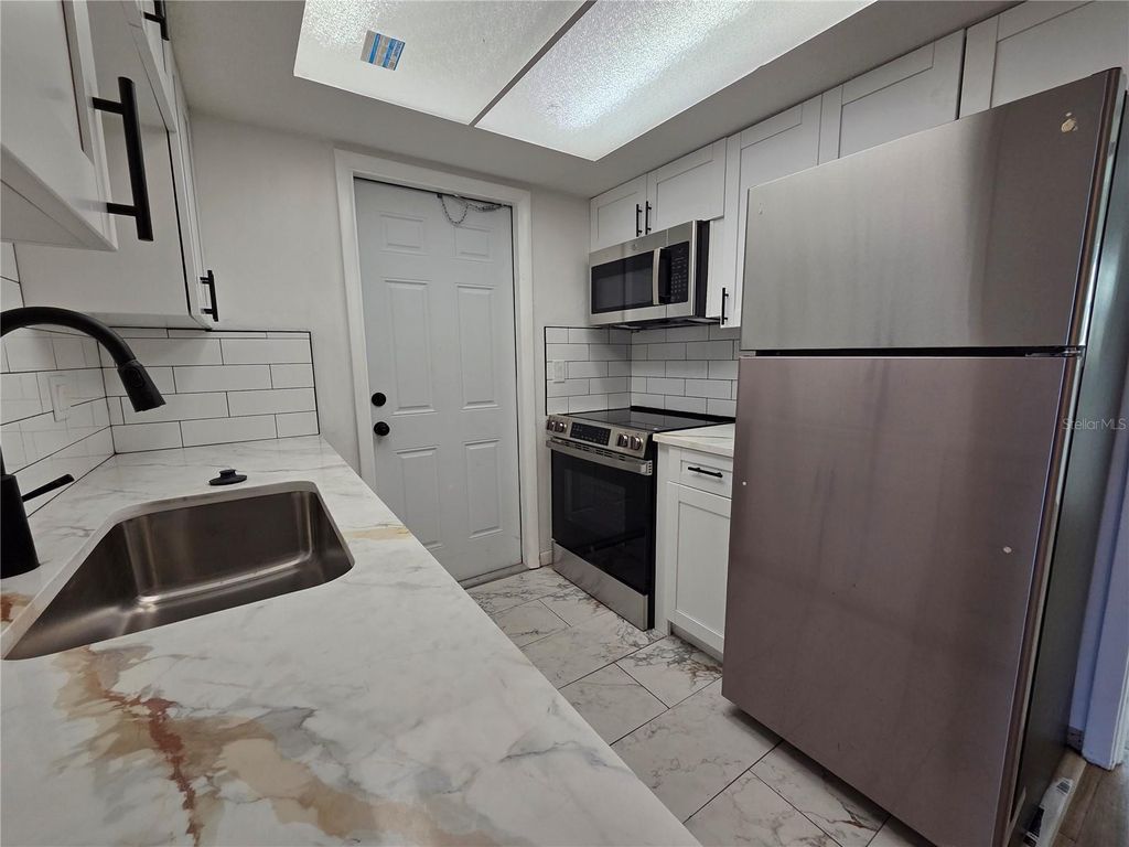 Photo of 606 S Betty Lane #C, Clearwater, FL 33756 (MLS # TB8472387)