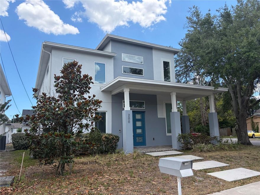 Welcome to your new dream home! Perfectly positioned on a desirable corner lot, this stunning two-story contemporary home offers elevated design, exceptional craftsmanship, and an unbeatable downtown lifestyle. With 4 bedrooms, 3.5 baths, fresh interior and exterior paint, and thoughtfully designed spaces throughout, this custom-built home is a rare opportunity in one of Orlando’s most sought-after neighborhoods. Step through the front door and into a breathtaking 25-foot foyer that immediately sets the tone for the home’s welcoming design. Soaring 10-foot ceilings on both levels, solid 8-foot doors, recessed lighting, and an abundance of natural light create a bright, open atmosphere that feels both grand and inviting. At the heart of the home, the gourmet kitchen is designed to impress. Quartz countertops, all-wood self-closing cabinetry, a built-in oven and microwave, smooth glass cooktop with pot filler, brand-new stainless steel appliances, and an oversized walk-in pantry combine style with function. The expansive breakfast bar with additional storage offers the perfect gathering space, all while overlooking the spacious family room for effortless entertaining and everyday connection. Upstairs, an open loft provides incredible versatility, making it ideal as a fitness area, media room, game space, or creative retreat. Two secondary bedrooms feature walk-in closets and are connected by a beautifully designed Jack-and-Jill bath with dual quartz vanities and an oversized linen closet. The primary suite is a true showpiece, offering a luxurious private escape complete with an enormous 14’ x 9’ walk-in closet. The spa-inspired bath features dual quartz-topped vanities, a freestanding soaking tub, and an expansive 6’ x 6’ walk-in shower designed for ultimate comfort and relaxation. Every bedroom includes ceiling fans, while thoughtful finishes throughout reflect the home’s exceptional quality and attention to detail. The oversized garage also includes a convenient half bath, adding extra functionality for guests and entertaining. Beyond the home itself, the location is second to none. Enjoy Orlando’s vibrant urban lifestyle with a short walk to Wadeview Park, SODO shopping, top-rated restaurants, and fitness centers. You’re also just minutes from Orlando Health, MD Anderson, Arnold Palmer Hospital, Winnie Palmer Hospital, and all the conveniences that make this district so highly desirable. Zoned for highly rated Blankner K-8 and Boone High School, this home offers both luxury and location. Don't miss out on this amazing home, schedule your private showing TODAY!!