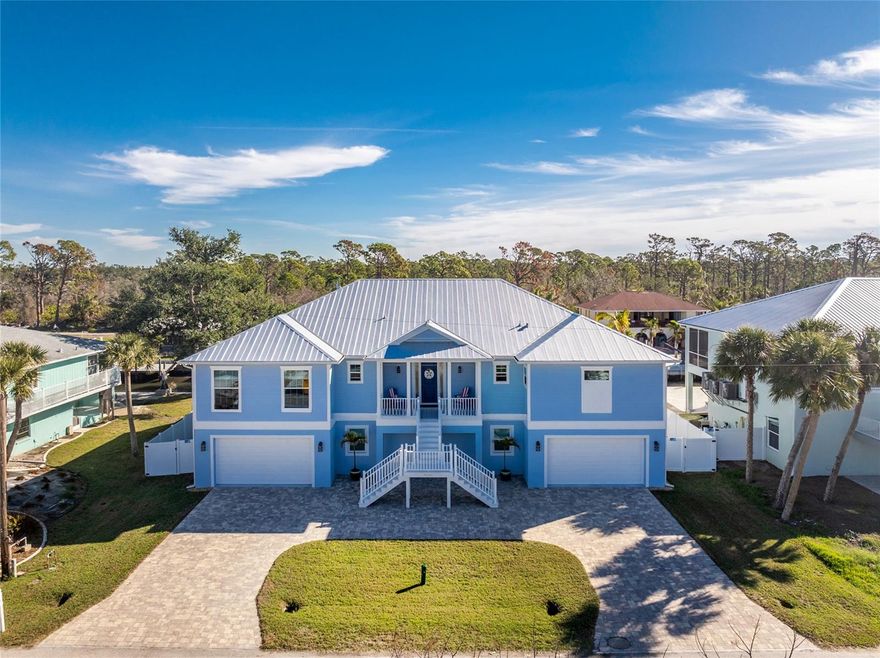 Completed in 2021, this CUSTOM-DESIGNED WATERFRONT RETREAT offers the rare opportunity to own a like-new, thoughtfully crafted home without the wait, cost and stress of building from scratch. Positioned on a DEEP-WATER CANAL with QUICK ACCESS TO THE GULF, this property offers every Boater’s dream home along with the necessary PEACE OF MIND that comes with an newer, quality build. Every detail of this property was carefully planned, combining modern elegance with functional living spaces tailored to optimize every square foot and outfitted with a WHOLE HOME ELEVATOR for maximum access and enjoyment. The spacious layout showcases a COFFERED CEILING GREAT ROOM with large pocket sliding glass doors that effortlessly flows to the whole home length lanai. The GOURMET KITCHEN has ample counterspace and cabinetry with closet pantry, upgraded appliances, island and overlooks the large dining nook with picture window. A SIZEABLE PRIMARY SUITE is tucked on the south side of the home with French door access outside, two walk-in closets and an ensuite bathroom sure to impress. This main floor also holds the second bedroom with full ensuite bathroom and French door outside access, oversized third bedroom, third bathroom, laundry room and multiple custom closets. NOT TO BE OVERLOOKED IS DETAILS SUCH AS tray ceilings, crown molding, solid core doors throughout, luxury vinyl plank flooring, fully tiled showers and more! The outdoor space is just as impressive with an expansive covered deck overlooking the tranquil pool and canal, providing a peaceful setting for evening relaxation or spacious gatherings along with a front porch that offers peek-a-boo views of the bay and gorgeous sunset skies. DOWNSTAIRS, your storage dreams are fulfilled with a FOUR-CAR GARAGE, oversized storage closet and an additional storage room with second refrigerator. A large, full fourth bathroom for this level provides convenience along with the 800+ SQUARE FOOT AIR-CONDITIONED BONUS ROOM perfect for a second living room, home gym, additional guest sleeping space and more! With two sets of sliding glass doors to the pool area, this is the extra breathing space your family has been looking for! The HEATED, SALTWATER POOL AND SPA features a sunshelf with umbrella holder and pebble tec finish – all framed by an expansive concrete paver deck, outdoor wetbar and two-story aluminum screen enclosure (20/20 no-see-um screen.) 100 FEET OF CONCRETE SEAWALL features water and power at both ends, a Trex dock and COVERED 10,000 POUND BOAT LIFT. Aside from the home itself – the best thing this property offers is location. Pine Cove is a friendly, quiet neighborhood tucked away on a dead-end street and just minutes by boat to the area’s best fishing, sandbars and waterfront restaurants. NO BRIDGES TO THE GULF. ADDITIONAL FEATURES to note include the circular paver driveway, white vinyl privacy fence, generator plug in, sprinkler system, whole home water filtration system, metal roof, cement siding, IMPACT WINDOWS AND DOORS, 80-gallon hybrid water heater with heat pump and MORE! Built with quality and care, this home eliminates the delays and uncertainties of new construction while delivering instant gratification. Call today for showing and a fully detailed feature list!