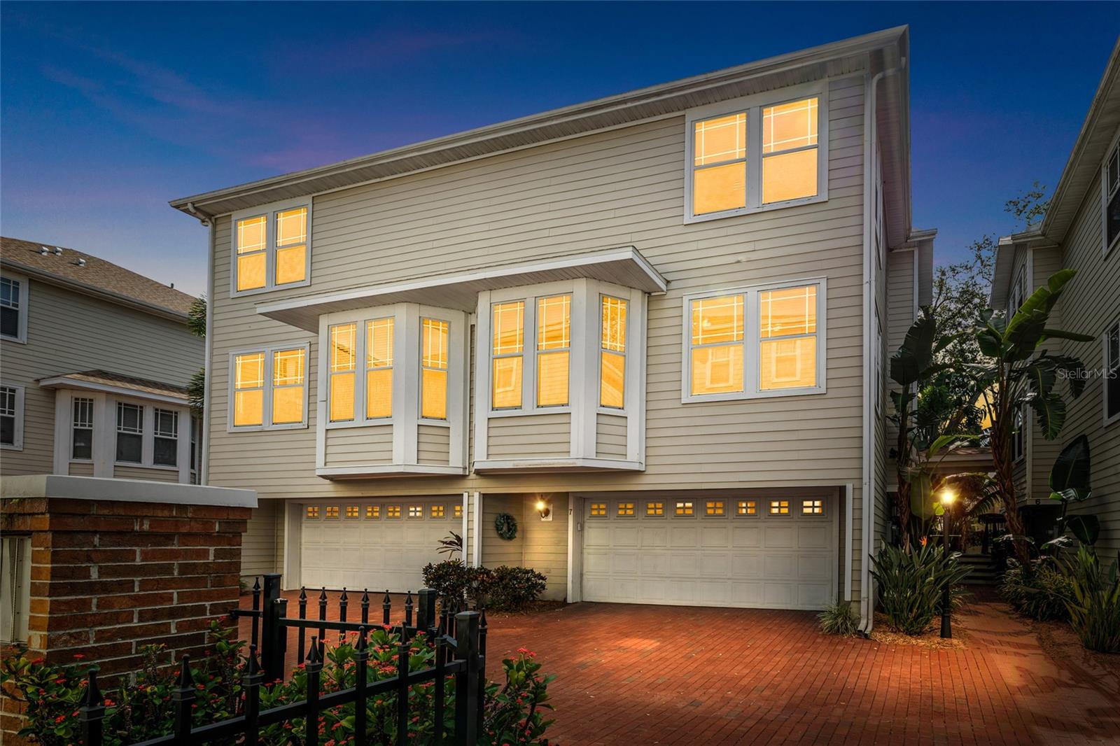 One or more photo(s) has been virtually staged. Welcome home to this beautiful 3-bedroom, 3-bath, 1930 sq ft townhome with large 2 car garage nestled in a gated community in the heart of South Tampa! From the moment you walk in, you’ll be wowed by the soaring ceilings, rich hardwood floors, and all the natural light that fills the space—creating a warm, luxurious feel. The main living area on the first floor features an impressive gas fireplace, 20-foot ceilings, and plenty of room to relax, entertain, or simply unwind after a long day. Head up to the second floor, where all the action happens! You’ll find a gorgeous dining area with hardwood floors and a striking open view down to the living room. The kitchen is a true highlight, complete with a charming bay window breakfast nook that soaks in the morning sun. This floor also includes a full bathroom and a flexible bedroom that works perfectly as a guest room, office, or playroom—whatever suits your lifestyle. And saving the best for last—on the top floor, you’ll fall in love with the oversized primary suite! There’s plenty of room for a king-sized bedroom set and a cozy seating area where you can unwind at the end of the day. There’s even a built-in Murphy bed—perfect for movie nights with the kiddos! The spacious en-suite bath features a relaxing garden tub, a walk-in shower, and a beautiful walk-in closet. The large second bedroom also includes its own private bath and walk-in closet, making it a true second primary suite. The oversized two-car garage is a fantastic bonus, offering plenty of room for both vehicles and extra storage. Need a peaceful moment to yourself? Step out back to a private, tucked-away sitting area—the perfect spot for your morning coffee or evening wind-down. The gated community features charming brick streets, lush landscaping, and a sparkling pool for you to enjoy. With only 20 units, it’s an intimate, peaceful community that truly feels like home. Located in a prime spot and slated for Grady, Coleman and Plant, its also just is minutes away from downtown, University of Tampa, MacDill, the airport and all major roads. Don’t miss your chance to live in one of South Tampa’s most desirable locations—come see it for yourself!