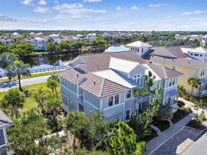 Discover award-winning Harbour Isle, a gated, resort-style community on gorgeous Anna Maria Sound offering an array of luxurious amenities including a state-of-the-art marina with deep-water access to the Gulf of Mexico, a charming Beach Club with a poolside cabana bar, a fun splash pad, a park, and a fully equipped fitness center.  Located 1 mile from the beaches of Anna Maria Island, and equipped with hurricane impact-rated windows, this community offers the finest in Florida coastal living, while providing protection from storms.  The community sustained only minor damage from the fury of last year's hurricane Milton.  This TURNKEY FURNISHED ground floor coach home offers over $50,000 in upgrades, including new flooring and furnishings throughout; and newly remodeled master and guest baths.  2 bedrooms and 2 baths plus a cozy den with murphy bed, and a much sought-after covered and screened lanai provides an abundance of living and entertaining space.  Plantation shutters filter the sunlight through the many windows creating a bright and welcoming living space.  The beautiful flooring features porcelain tile in kitchen and family rooms, plus engineered plank tile flooring in the bedrooms, den, baths and hallways.  Have your morning coffee enjoying the offshore breeze in the large screened lanai, then prepare breakfast in the gourmet kitchen with 42-inch solid wood cabinets, pull-out cabinet shelves, stainless steel appliances, and quartz countertops.  Beautifully updated primary and guest bathrooms feature new vanities, flooring, lighting and walk-in showers in both baths.  An attached 24-feet deep 2-car garage will fit any size vehicle and still have room for bikes, kayaks and all your beach stuff.  Harbour Isle is a 220-acre private island oasis located directly across from Anna Maria Island on Anna Maria Sound in Bradenton, Florida.  The moment you enter the gates you'll be surrounded by the community's distinctive and charming southern coastal, resort-style design and architecture including a lighthouse-like observation tower at the community’s gated entrance that opens upon a Royal Palm-lined streetscape and sparkling 38-acre lake at the center of the community. The colorful resort coach homes complete an inviting picture of relaxed seaside living.  The 23,000 square-foot Beach Club at Harbour Isle opens to breathtaking views of Anna Maria Sound and the Intracoastal Waterway. Impressive luxury amenities include a 4,200-square-foot fitness center, second floor Sky Bar Lounge with billiards area and second floor balcony for outdoor dining. Other Club amenities include a covered Cabana Bar, resort-style swimming pool, Jacuzzi, private lounging cabanas, yoga lawn, event lawn and beach recreation for launching kayaks and paddleboards.