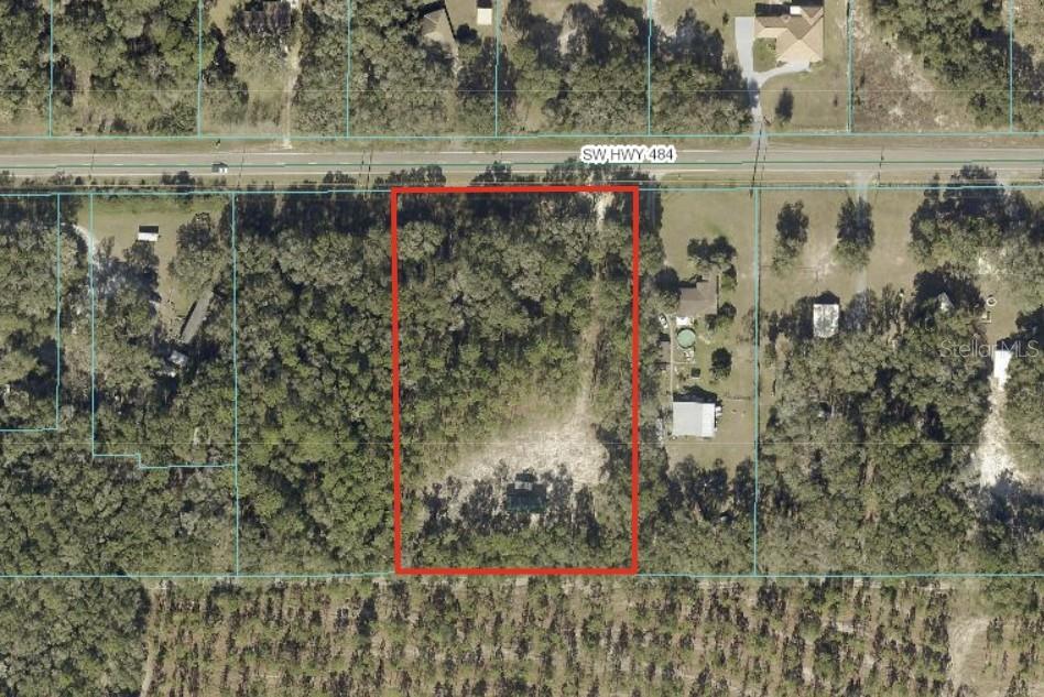 Under contract-accepting backup offers. Not just another plot of land. THIS has everything you are looking for - 3 acres, AG Zoned, backs up to the Cross Florida Greenway, dry, on a paved road, partially cleared for a homestead in the back, driveway cleared and a concrete apron with culverts has been poured at the road. The prep work has been done, all you need is your plans for a mini-farm or nature getaway. Survey available. Short easy drive to Walmart, hospital, restaurants, etc. Come check it out before someone else decides to take it.
