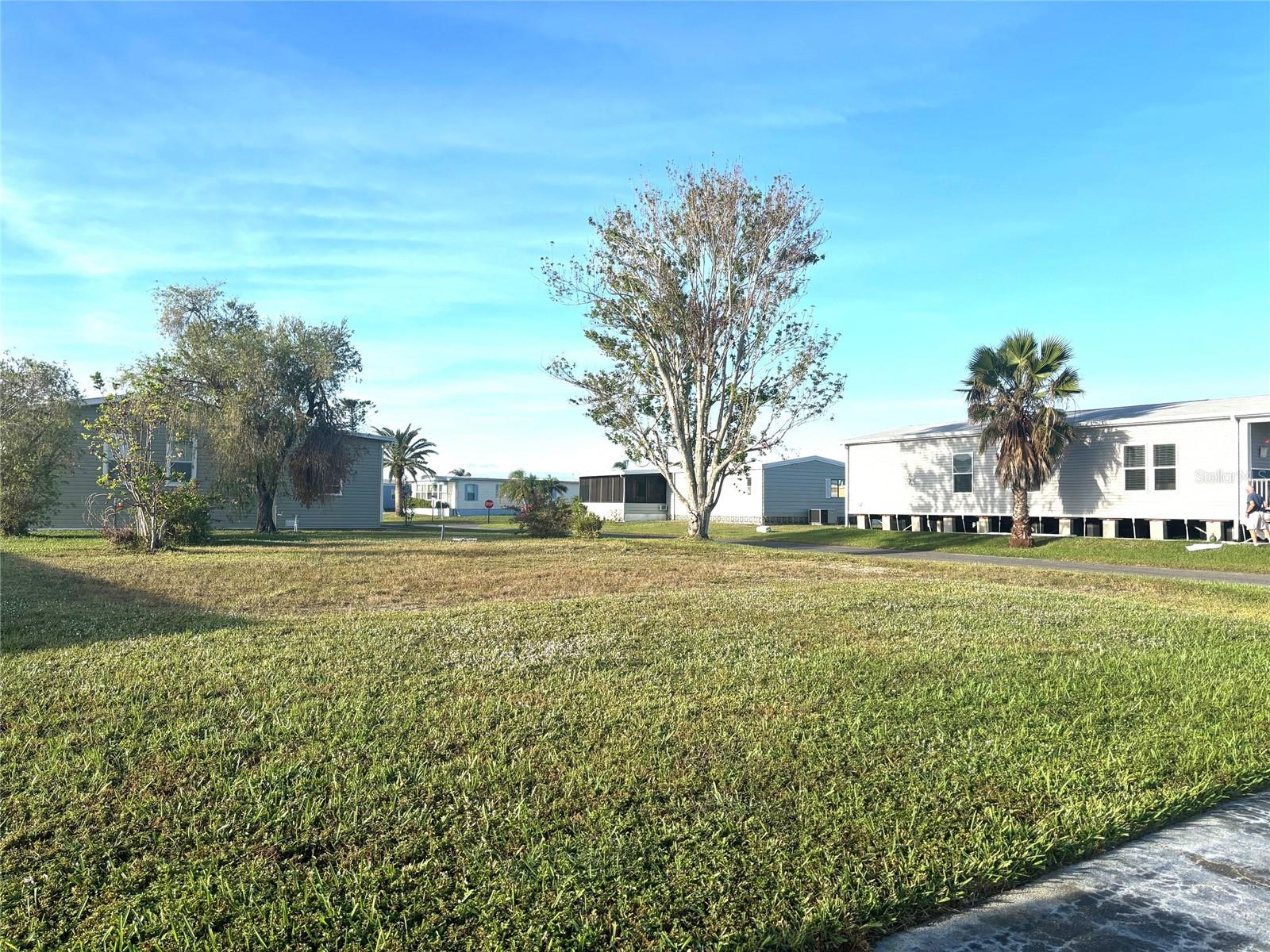 Vacant lot with a view of one of our 8 beautiful lakes. La Casa, a vibrant 55+ community, offers the ultimate Florida lifestyle. We have 974 homes nestled among a variety of native trees with spacious common grounds surrounding our eight lakes. Located between Sarasota and Fort Myers, this is a boater's dream with access to the Gulf of Mexico. It is convenient for shopping, sightseeing, golfing, fishing, and boating, as well as all the culture and elegance the Southwest Florida area is noted for. La Casa may have the best pools in the area. Our crown jewel is an extremely large, 40 X 60-foot swimming pool that is kept at a perfect 87 degrees. Our smaller 20 x 40 pool is quietly nestled between the clubhouse and the Activity Building. Both pools have adjacent hot tubs which are ideal for soaking muscles that are tired from golfing or tennis. Wireless Internet (Wi-Fi) is available at the Clubhouse, Activity Building, and Recreation Hall area where these pools & spas are located, so you can catch some rays while you catch up on your email! Sound enticing? Come for a visit to this self-contained oasis and see for yourself why La Casa is the ultimate destination for both snowbirds and year-round residents!