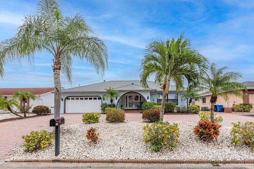 PERFECT GATEWAY FOR MILITARY HOUSING, CORPORATE HOUSE, OR SO MANY OTHER PEOPLE .  Short or long-term available after October 20th, depending on availability and rates do CHANGE depending on season.. Weekly rates are $2200 plus a cleaning fee of $239, which includes electric/water/cable and all current furniture as seen! (Great for military personnel wanting a getaway or anyone...) These dates and prices may change, so please inquire!  It is completely furnished and includes utilities! Welcome to resort-style living.  This beautiful canal-front 3-bedroom 2, 2-bath pool home is turnkey furnished with everything you need to enjoy a Florida lifestyle. HEATED POOL FOR THOSE COLDER WINTER DAYS, and you will love fishing from the dock with the deep glow green light. Upon entering through the leaded glass double doors, you are instantly transported to paradise through the coastal vibe throughout the home.  The formal living room and dining area, rich with warm wood flooringoverlookks the HEATED (HEAT PUMP) pool area with an outdoor living area straight out to the canal and dock.  The updated kitchen features granite counters, wood cabinets, and stainless appliances, including a wine fridge and tile floors.  Doing the dishes is no problem while watching for dolphins looking out the pass-through window.  The family room features a wood-burning fireplace and pocket sliding glass doors to take advantage of the tropical breezes.  The master suite has sliders that offer easy access to the pool and lanai area, a nice walk-in closet, and a lovely, updated bathroom with dual sinks and additional linen closet.  Behind the master bedroom, the extended screened-in lanai has a pool table for billiards night with friends.  Bring your boat, as this home also offers a 10,000 boat lift,  and a floating dock perfect for launching kayaks and paddleboards. Also, ping pong, darts, foosball, and cornhole. A short ride and one turn get you quickly out into Tampa Bay. Apollo Beach is ideally located in the Tampa Bay region close to Busch Gardens and about an hour and a half drive to Disney and Universal.  Close to shopping and great restaurants make this an excellent retreat. Be sure to click on the photos to enlarge and see the descriptions.