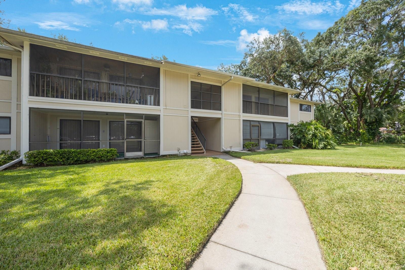 Step into your second level 2 bedroom and 2 bathroom spacious condo at Raintree Village Condominiums. Beautifully updated throughout with laminate flooring. In addition you will enjoy a seperate private office space. The kitchen is complete with newer wood cabinets with granite countertops and equiped with stainless steel appliances. Off of the living room and office out of the dual sliding glass doors a large screened in lanai with a large laundry closet with the washer and dryer included. Living room and dining room combo offer ample space and also has closet space, ceiling fans and a smart thermostat. New A/C installed as well as new HW heater. Also newly painted walls with chair railing for an appealing touch. Down the hall the first bedroom with large closet, ceiling fan and window. The next is the bathroom with beautiful tile and walk in shower with glass doors. All new granite vanity, new fixtures and toilet. Continue to your spacious primary bedroom with en suite bathroom and walk in closet plus a linen closet. Bathroom features new granite vanity, fixtures, toilet and beautiful tile walk in shower with glass doors. Raintree Village Condominiums is a perfect location for convienience to USF, Moffitt Hospital, Mosi, Yuengling Center, Busch Gardens, shopping, restaurants, I-275, I-75 and I-4 and so much more. Whether you are looking for your next home or an incredible investment opportunity, dont miss the chance to buy this NOW!!