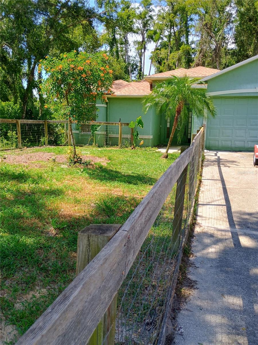 With a little paint and flooring, this place could be your paradise. House has a great floor plan. The kitchen has many cabinets and a lot of room. Family room and living room are very large. Built next to Moon Lake Park with a boat ramp right next door. Park also includes a playground and a picnic area. NEW ROOF REPLACED 6/25 and the air conditioning unit was replaced in 2020. Home Warranty for 1 year. Hurricane panels for the hurricane season. Conveniently located to shopping and the Suncoast Parkway. Tampa International Airport is only 45 minutes away.