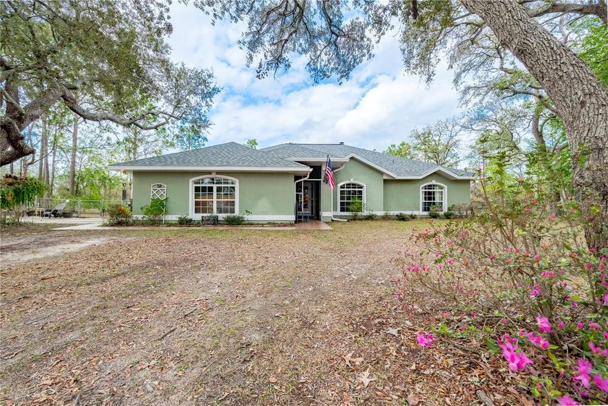 Welcome to this beautifully updated 3-bedroom, 2-bathroom home on 5 tranquil acres in Morriston, FL. Offering a perfect combination of modern comforts and country living, this property is ready for you to move in and enjoy. Recently updated with a new roof, new A/C, new flooring, and a new water heater, this home provides peace of mind and efficiency, making it the ideal place to settle down. Inside, the home boasts a spacious, open layout with a bright and airy living room with a wood burning fireplace. The well-appointed kitchen features ample cabinetry, counter space, and modern appliances, making it the perfect space for preparing meals and entertaining. The adjacent dining area is perfect for family dinners or hosting guests. The master bedroom is generously sized, with a private en-suite bathroom offering both convenience and privacy. The two additional bedrooms are equally spacious, with plenty of closet space and easy access to the second full bathroom. One of the standout features of this property is the large 25’X35’ barn/work shop with loft for storage and also water hook up , offering a great space for hobbies, projects, or additional storage. For those with an RV, this property also includes an RV hookup, making it easy to park and access utilities while traveling or when hosting guests. The outdoor living space is perfect for enjoying the Florida weather, featuring a screened-in patio with a charming brick grill, ideal for outdoor cooking and entertaining. Whether you’re hosting a BBQ or just relaxing in the fresh air, this space will quickly become a favorite spot. With 5 acres of land, there’s plenty of room for outdoor activities, gardening, or even expanding your living space. Enjoy the privacy and tranquility of country living while still being just a short drive from local amenities and attractions.