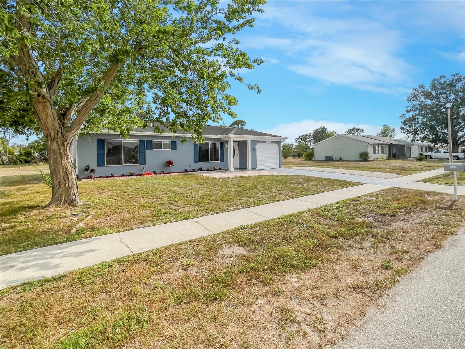 Welcome to your beautifully updated 2-bedroom, 2-bath home with a 1-car garage in the highly desirable Jockey Club of North Port! Just a short walk to the community clubhouse and pool, and minutes from shopping, dining, and top-rated schools, this location offers unbeatable convenience and charm. Step inside to discover luxury vinyl flooring throughout, giving the home a sleek, modern feel. The fully renovated kitchen features brand-new granite countertops, stainless steel appliances, and a built-in wine cooler—perfect for entertaining or relaxing in style. Enjoy Florida living at its finest with a spacious screened-in lanai overlooking the oversized backyard, ideal for pets, play, or future garden plans. Don’t wait—homes in this sought-after neighborhood move fast. Schedule your showing today!