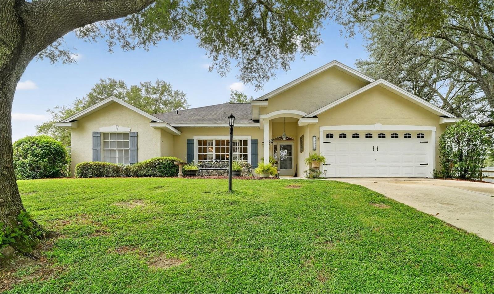 Spectacular, newly remodeled ranch home in wonderful Hills of Mount Dora! Quiet, Picturesque, country subdivision with very easy access to Disney and Orlando on the 429 toll way. This expansive property boasts a large, private completely fenced yard spanning over one acre, complete with mature trees and the added benefit of no rear neighbors. Additional fenced, shaded courtyard area with beautiful, flowering bushes & plants with a walkway to additional concrete patio. Short drive to quaint downtown with many restaurants, boutique shops and festivals. Gorgeous eat-in kitchen, with new 36" white cabinets, granite counters, all stainless appliances, island, breakfast bar and fixtures Great home for entertaining with 2 dining areas, separate formal living room and family room. French doors lead out to the huge Florida room. This room could be great for a home business or office with access to the secondary bathroom. All new light fixtures and ceiling fans including in all 4 bedrooms. Beautiful master bath with new granite, double sink vanity, light bar, faucets, soaking tub and separate shower. Secondary bath also has new granite countertop, fixtures and faucets. Newer carpet in all four bedrooms and low maintenance, laminate flooring throughout the rest of the home. Interior and exterior recently painted in beautiful, neutral colors. Located near great elementary charter school and very short drive to one of Florida's largest Flea market and antique shopping! You better hurry, this amazing, must see home will go fast and is in great move in condition!