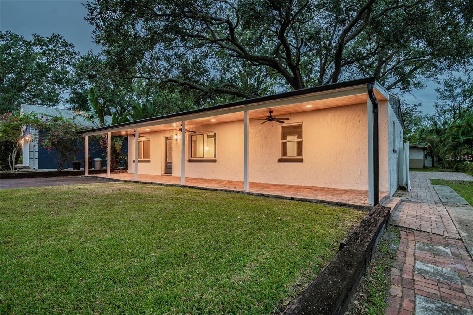 Welcome to Wellswood, one of Tampa’s most beloved and hidden-gem neighborhoods! Surrounded by majestic, sprawling oak trees, this beautifully updated home offers comfort, character, and convenience all in one.
As you arrive, you’ll be greeted by a grand front porch stretching across the home’s façade, complete with ceiling fans and lighting so you can relax and enjoy Florida evenings in style. Step inside and you’ll find a spacious living room flowing seamlessly into the brand-new kitchen. The kitchen features granite countertops, modern appliances, abundant cabinet storage, and a striking green tile backsplash that adds warmth and charm.
Adjacent to the kitchen is a formal dining room large enough for a full dining set plus additional furniture, making it the perfect spot for gatherings. At the rear of the home, the primary suite offers a walk-in closet, sliding doors leading to the patio, and a stunning updated bathroom with a sleek walk-in shower and stylish finishes.
Two additional bedrooms are tucked away on the opposite side of the home, each generously sized and sharing an upgraded hallway bath with a walk-in shower, oversized vanity, and large mirror.
The backyard retreat is shaded, spacious, and ideal for entertaining. A massive deck provides ample space for outdoor living, while side access opens to a large parking pad—perfect for extra vehicles, a boat, or recreational toys. At the rear of the property, a large enclosed shed offers endless possibilities: home office, workshop, gym, or creative studio.
Beyond the home, Wellswood’s charm shines through its walkable, welcoming streets and unbeatable location. Enjoy easy access to I-275, Raymond James Stadium, downtown Tampa, and all the shopping, dining, and entertainment the city has to offer.
Don’t miss your chance to call this stunning Wellswood property home—schedule your tour today!