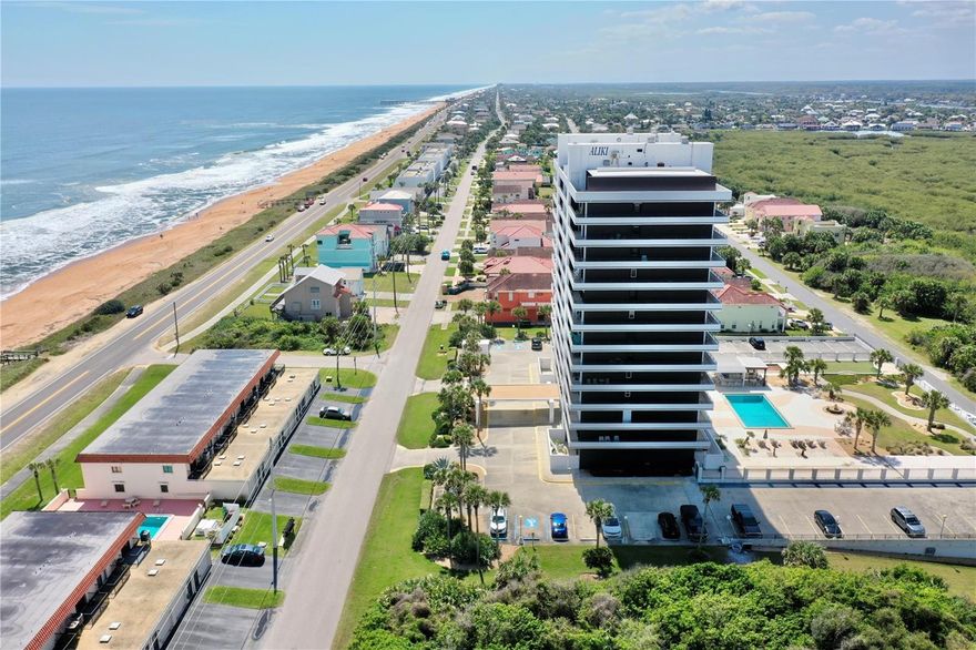 Welcome to coastal paradise at the Aliki in Flagler Beach, where breathtaking Atlantic Ocean views and the soothing sound of waves create the perfect backdrop for your everyday life. This beautifully remodeled 2-bedroom, 2-bath condo offers direct oceanfront living with two expansive private enclosed patios spanning the length of the residence—perfect for entertaining with privacy.

Inside, you'll find an open-concept floor plan with floor-to-ceiling glass sliders that flood the living space with natural light. The updated kitchen features granite countertops, wood cabinetry & a breakfast bar ideal for casual dining or entertaining. Full appliance package including washer & dryer in laundry room.

The spacious primary suite offers rear patio entrance & ensuite bathroom with walk-in shower. A generous guest bedroom and second full bath make hosting friends and family a breeze. 

Condo fees cover water, cable, internet, trash, pool, all exterior maintenance, exterminator & insurance. Owner pays electricity.
