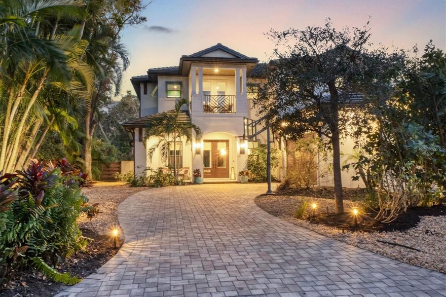 West of the Trail, West of Osprey, sits this exquisite Majestik Homes-built estate, perfectly positioned within one of Sarasota’s most desired neighborhoods. A seamless blend of design and function awaits as you enter the home, where the open-concept floor plan creates an inviting atmosphere. Rich wood-grain tile floors, contemporary wall treatments and beam ceilings infuse the home with artistic charm and warmth. The gourmet kitchen is a chef’s dream, featuring custom cabinetry, marble and quartzite countertops, premium stainless steel appliances, Sub-Zero refrigeration and an expansive center island with built-in wine refrigerator — ideal for culinary enthusiasts. Through the large sliding doors, the indoor-outdoor living space comes alive, offering a resort-style pool, spa and full outdoor kitchen, creating a harmonious space to entertain or relax. The covered lanai features a full kitchen, lounge space, gas fire pit connection, retractable screening and is perfect for entertaining. On the lower level, the owner’s suite serves as a private retreat, complete with wood-beamed ceilings and a spa-inspired bath offering a Roman shower, soaking tub and serene pool views. Upstairs, three generously sized bedrooms (with a fourth bedroom perfectly suited for guests) and a flexible open space with a balcony provide ample room for family and guests. The property is ideally located less than one mile from Morton’s Gourmet Market and the dining and shopping options of Southside Village. With downtown Sarasota, Sarasota Memorial Hospital, Sarasota High School, Southside Elementary, St. Armands Circle and Siesta Key all just a short drive, walk or bike away, this home offers the perfect balance of privacy and convenience. From the stunning curb appeal to the thoughtfully designed interiors, this home delivers a quintessential Sarasota lifestyle, combining sophistication, comfort and tranquility. You can rest easy knowing you’re protected with impact, hurricane-rated, windows and doors. The home also sits at an elevation where flood insurance is not required and there was no damage or water intrusion from past storms. Welcome home.