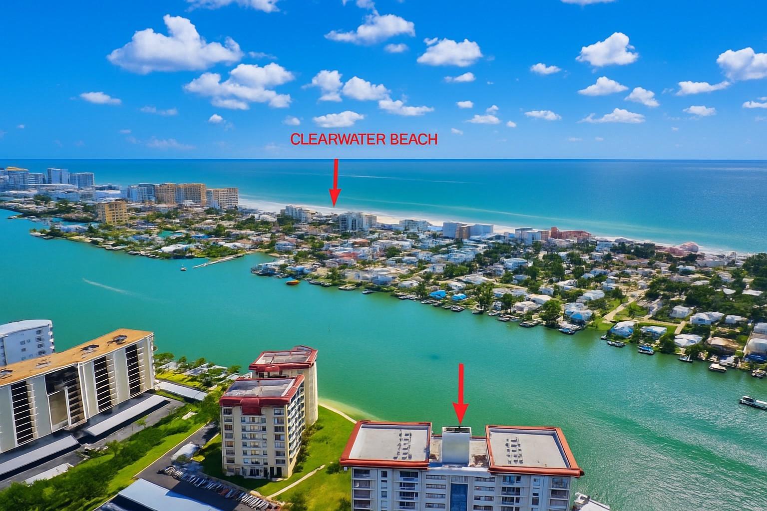 Welcome to waterfront living at its finest in this spacious 2-bedroom, 2-bath west facing condo boasting over 1,900 square feet and breathtaking water views from every window. Perfectly situated in the highly desirable Island Estates community of Clearwater Beach, this residence offers the rare combination of size, location, and resort-style amenities. From the moment you step inside, the panoramic views of the Gulf, Intracoastal, pool, and marina will captivate you. The open floor plan is designed for both comfort and entertaining, featuring a beautifully updated kitchen with abundant custom storage, stainless steel appliances, double built-in ovens, wine refrigerator, designer granite countertops, and water views from the sink. A built-in seating area flows seamlessly into the expansive great room, while the dining area offers the perfect backdrop of passing boats and playful dolphins. Just off of the dining room you will find a private balcony with breathtaking views and a private storage room. The primary suite is a true retreat with sweeping water views, a private balcony for enjoying stunning sunsets, a large walk-in closet with built-ins, and a ensuite with double vessel sinks, generous storage, and an oversized walk-in shower with beautiful tile work and framless glass enclosure. The second bedroom also enjoys endless water views, a wall of closets, and custom plantation shutters. An updated second bathroom completes the layout, featuring a modern vanity and a tub/shower combo—offering comfort and convenience for guests or family. Storage is abundant with multiple hallway closets, plus a large laundry room with a full-size washer and dryer, water softener, and more cabinetry. Recent upgrades include brand-new impact windows and sliders, as well as a newer HVAC system (2020), providing peace of mind for years to come. This pet-friendly building welcomes one cat or dog up to 35 pounds and features secure entry, covered parking, private storage, tennis courts, fitness center, clubhouse, billiards, and so much more. Best of all, all special assessments will be covered by the seller. Move-in ready and meticulously maintained, this condo is the one you’ve been waiting for—schedule your private tour today and start living the waterfront lifestyle!