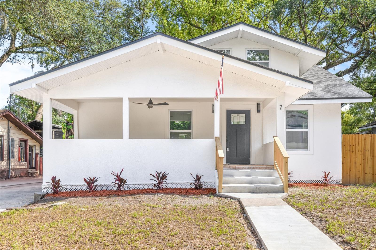 Welcome to this beautifully updated home nestled in the sought-after neighborhood of Old Seminole Heights—a community known for its historic charm, friendly vibe, and walkable amenities. From the moment you arrive, you'll fall in love with the inviting curb appeal, highlighted by a spacious front porch complete with a ceiling fan—the perfect spot to relax and enjoy the neighborhood atmosphere. Step inside to a bright and airy open-concept floor plan, where the living and dining rooms flow seamlessly together, creating an ideal space for both everyday living and entertaining. The kitchen features newer cabinets, sleek quartz countertops, and stainless steel appliances. Also on the main floor is a generously sized primary bedroom with an ensuite bathroom and ample closet space, along with a second full bathroom for guests and a convenient indoor laundry room. Upstairs, you'll find two additional bedrooms, a third full bathroom, and vaulted ceilings that add character and charm to the space. Step outside and enjoy the spacious backyard, perfect for outdoor gatherings, gardening, or creating your own private retreat. Best of all, this home is not located in a flood zone, offering peace of mind and potential savings on insurance. Located in a vibrant community with tree-lined streets, historic architecture, great restaurants, boutique shopping, and parks just minutes away, this home truly offers the best of urban living with a neighborhood feel. Don't miss the opportunity to own a move-in-ready home in one of Tampa’s most desirable and character-rich communities. Schedule your private tour today!