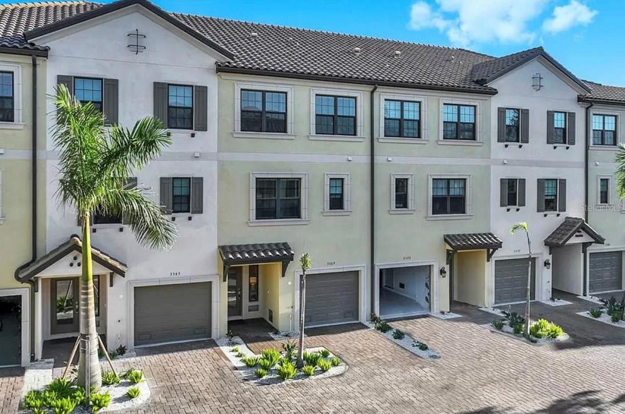 Impeccable in style, this 3-story townhouse has 4 bedrooms and 3 full baths and will be ready for occupancy on February 1! The stunning kitchen has GE cafe appliances including an induction cooktop, quartz countertops, and stainless steel appliances. 10' ceilings, a private elevator and a view of the water add to the incredible ambiance! This home is built to the latest hurricane codes with impact windows. This gated community is a short distance to Siesta Key beach, downtown Sarasota and Venice and offers a heated pool, fitness center and clubhouse. You have a beautiful water view from your screened balcony for your enjoyment and relaxation. UNFURNISHED and READY FOR OCCUPANCY!