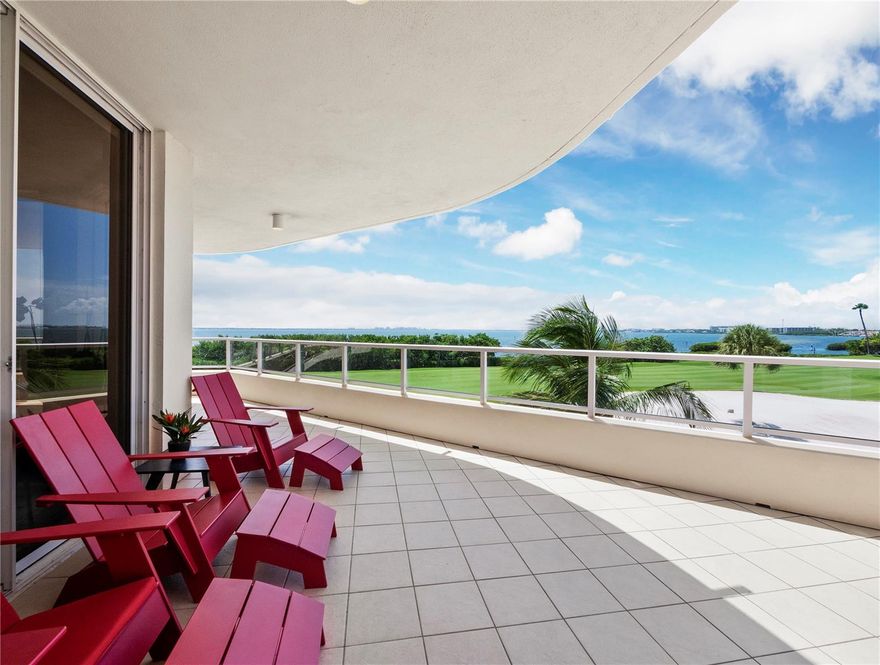 Prepare to be enchanted by the stunning, awe-inspiring views that await at this luxurious three-bedroom residence in the highly sought-after Grand Bay. With its sprawling 2,925-square-foot Antigua floorplan, this exquisite condominium offers the ultimate in elegant single-family living. From the moment you step off the private elevator and into the grand entry foyer, you will be struck by the meticulous attention to detail and the sophisticated neutral tones that create an atmosphere of sheer opulence and refinement. The black solid surface countertops and vibrant red tile backsplash are the perfect accompaniment to the sleek all-white cabinetry, making the gourmet kitchen a showstopper. Stainless steel appliances, a low-profile cooktop, and a magnificent tray ceiling complete the look. Access the expansive terrace from nearly every room, where you can enjoy the perfect vantage point to take in the breathtaking panoramas of Harbourside golf course, the city skyline, Sarasota Bay, and the Longboat Key Club Moorings. The master suite is a true retreat, with voluminous his-and-her closets and a modern-style renovated bathroom featuring a walk-in shower, floating vanity, and custom lighting. Grand Bay residents enjoy access to a host of unparalleled amenities, including a 24-hour manned guard gate, an exclusive clubhouse with a library and game room, fitness center, Har-Tru tennis courts, two heated swimming pools and Jacuzzis. When you're ready to hit the beach, deeded access to private Gulf shores is just a short bike ride away with membership to the exclusive Bay Isles Beach Club. Golf and tennis enthusiasts will appreciate the opportunity to join the prestigious Longboat Key Club, with its world-class facilities, while boaters will love the option to dock in deep water slips. If you are seeking the ultimate in luxury living with all the amenities you could wish for, this remarkable residence in the heart of Grand Bay is the perfect choice for you.