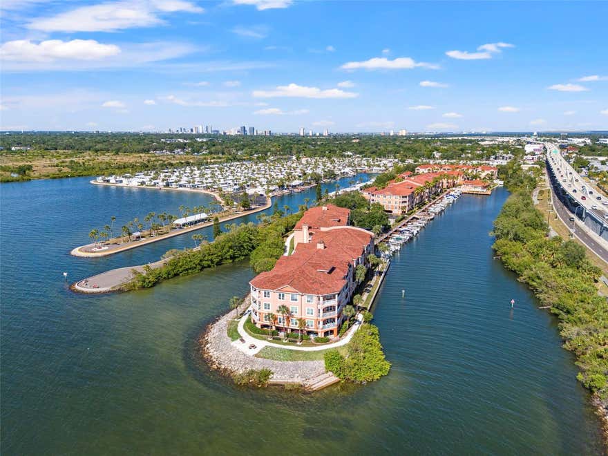 Welcome to Culbreath Key Bayside, a sought-after gated waterfront community in the heart of South Tampa! Conveniently located near the Gandy Bridge, Veteran’s Expressway, Downtown Tampa, Tampa General Hospital, local dining hotspots, shopping, and the Gulf beaches, this community offers the ideal blend of comfort and convenience. This beautifully maintained first-floor condo features 1 bedroom, 1 bathroom, and 780 square feet of thoughtfully designed living space. Inside, you’ll find luxury vinyl and tile flooring throughout, complemented by an abundance of natural light that creates a warm and inviting atmosphere. The kitchen offers wood cabinetry, sleek appliances, and a breakfast bar that opens directly into the spacious living room, making entertaining effortless. Tall ceilings and crown molding add an elegant touch to the open-concept layout. Step outside onto your private patio, complete with additional storage space, perfect for enjoying the Florida weather year-round. The oversized primary bedroom provides plenty of room for a full furniture set along with generous closet space. The bathroom features a modern vanity, decorative mirror, and a shower/tub combination for everyday convenience. Residents of Culbreath Key Bayside enjoy access to outstanding resort-style amenities including a waterfront pool with sun deck, fitness center, clubhouse, walking trails, dog park areas, kayak and bike storage, docks, boat slips, grilling stations, and scenic waterfront views throughout the community. Enjoy maintenance-free living in one of South Tampa’s premier waterfront communities. Don’t miss this opportunity — schedule your private tour today!