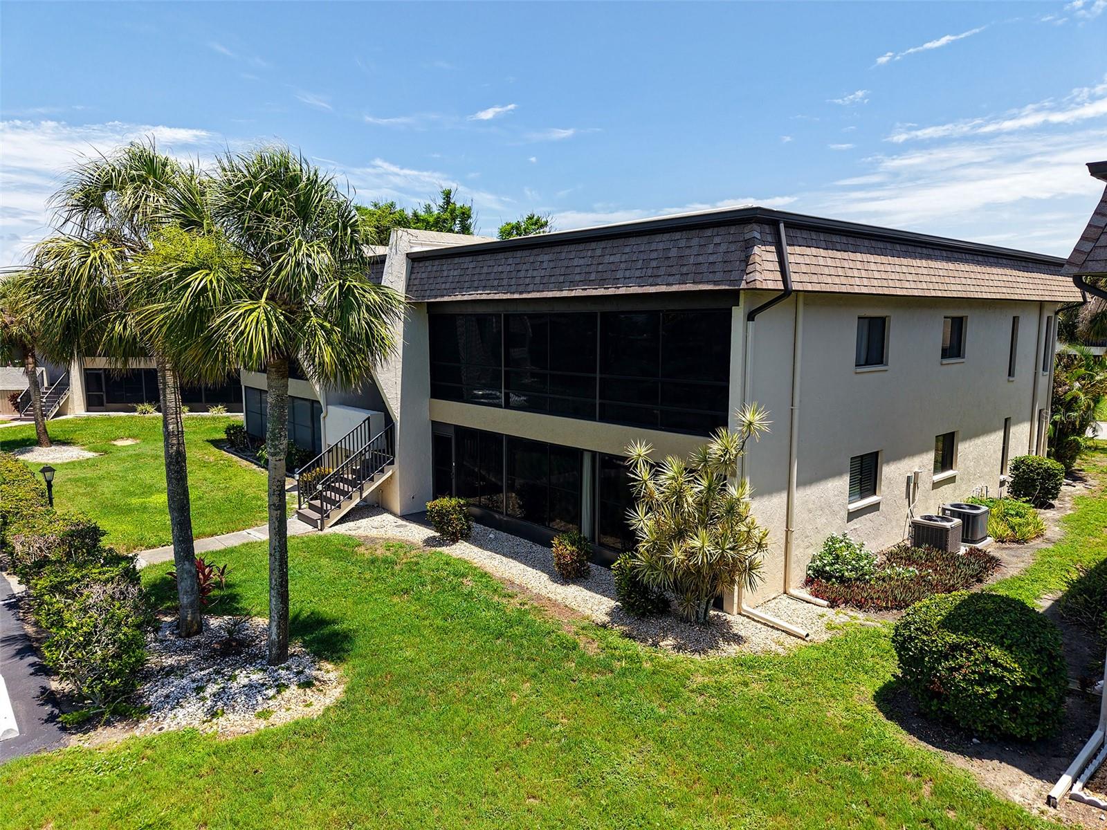 Welcome to this charming furnished 2-bedroom, 2-bathroom second-floor condo located at 1731 Bonitas Circle in the peaceful 55+ community of Villa Nova in Venice, Florida. This well-maintained unit features tile flooring throughout, central air conditioning, and a spacious screened lanai that spans the entire width of the condo—perfect for enjoying Florida’s beautiful weather year-round.
The kitchen is equipped with marble countertops and a full suite of appliances including a refrigerator, range, microwave, dishwasher, and garbage disposal. The adjoining laundry room includes a washer, dryer, utility sink, and extra storage space for added convenience. The primary bedroom features an en-suite bathroom and a walk-in closet, while the second bedroom also offers ample closet space and easy access to the guest bath.
Outside, residents enjoy access to two assigned carport parking spaces, additional guest parking, and a private storage closet. The Villa Nova community offers a range of amenities, including a heated pool, clubhouse, and beautifully landscaped grounds. HOA services include cable TV, building insurance, grounds maintenance, pest control, and exterior upkeep, making for a truly maintenance-free lifestyle.
Conveniently located near US-41 and Shamrock Boulevard, the condo is just minutes from historic downtown Venice, area beaches, shopping, dining, and medical facilities. Please note that residents must be 55 years or older, pets are not permitted