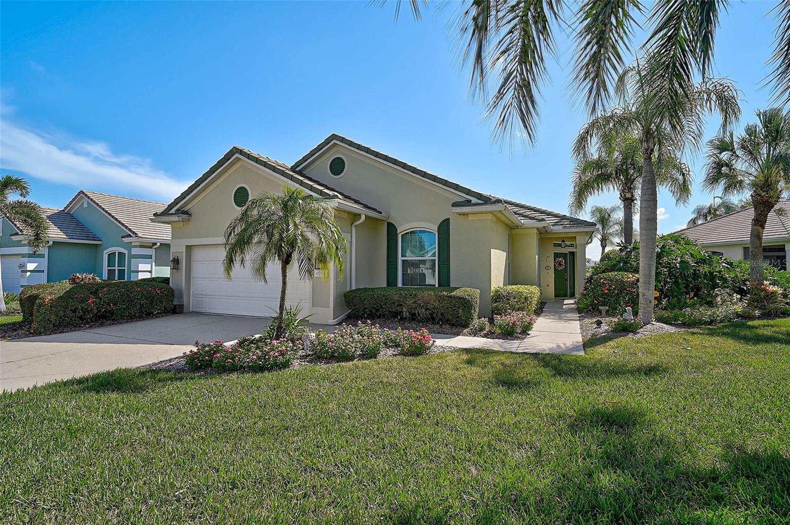 Making memories is easy in your new Peridia Isle home! This well-maintained 2BR/2BA + Den patio home offers a beautiful lake view and a thoughtfully designed floor plan ideal for comfortable living and entertaining. The kitchen features quartz countertops, refaced cabinetry, and newer appliances, with an open layout that flows into the dining and living areas, perfect for staying connected with family and guests. The primary suite includes serene lake views, a large walk-in closet, dual sinks, a soaking tub, and a separate shower. The second bedroom, located at the front of the home, provides added privacy for visitors. The den includes built-in shelves and a desk, with space to accommodate a pull-out couch for additional guests. Additional features include an interior laundry/utility room. The roof was replaced in 2021, and the A/C system was installed in 2020. Hurricane-impact windows and sliders are installed throughout the home, providing comfort and security. The screen-enclosed patio boasts a beautiful wood ceiling and retractable awning, creating the perfect spot to unwind with a good book, fire up the grill, or simply take in the peaceful water views. Located in Peridia Golf & Country Club, this property offers access to community amenities including a golf course, clubhouse, swimming pool, tennis courts, pickle ball, a Tiki bar & on-site dining. Residents may participate in a variety of social and recreational activities such as golf leagues, card clubs, bocce ball, pickleball, book club bowling leagues, Member Only events and much more. One-time capital reserve of $4,000 due at closing. Master Association-$877 Quarterly, Yard maintenance- 455 Quarterly. Annual Food/beverage Minimum- $450. One-time application fee of $200 is required for new residents.