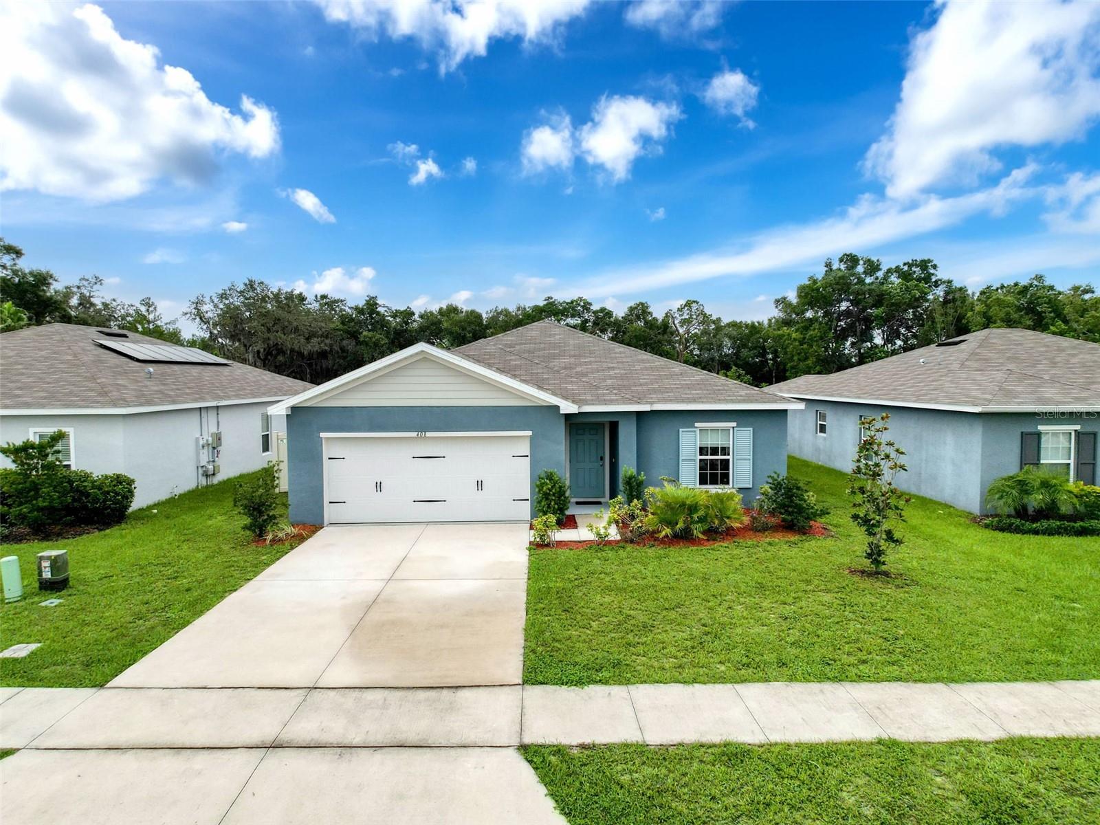 NO CDD and a LOW HOA of just $302 bi-annually make this 2021-built home, on a dead-end street, an incredible find, complete with a 10-year structural warranty and PAID OFF SOLAR PANELS-imagine the bragging rights when current peak summer electric bills have been under $121, offering impressive savings! This spacious 4-bedroom, 2-bath split floor plan offers an open layout with stylish ceramic tile flooring throughout the main areas, a Smart Nest thermostat and a Ring doorbell. The primary suite features an oversized walk-in closet and a beautiful en suite bath with dual vanities and a walk-in shower. The kitchen offers ample wood cabinetry, an island with a breakfast bar and a walk-in pantry. Start your mornings with coffee in the screened, covered lanai overlooking your vinyl-fenced backyard with NO REAR NEIGHBORS and a conservation view. Your new home is ideally situated between Orlando and Tampa, you’ll enjoy quick access to I-4, Posner Park shopping, Heart of Florida Hospital, Publix, and top attractions like Disney, Legoland, Universal, Bok Tower Gardens and local nature trails-offering the best of Central Florida. Be sure to explore the 3D walk-through link for an immersive virtual tour of this beautiful home! Schedule your showing today!