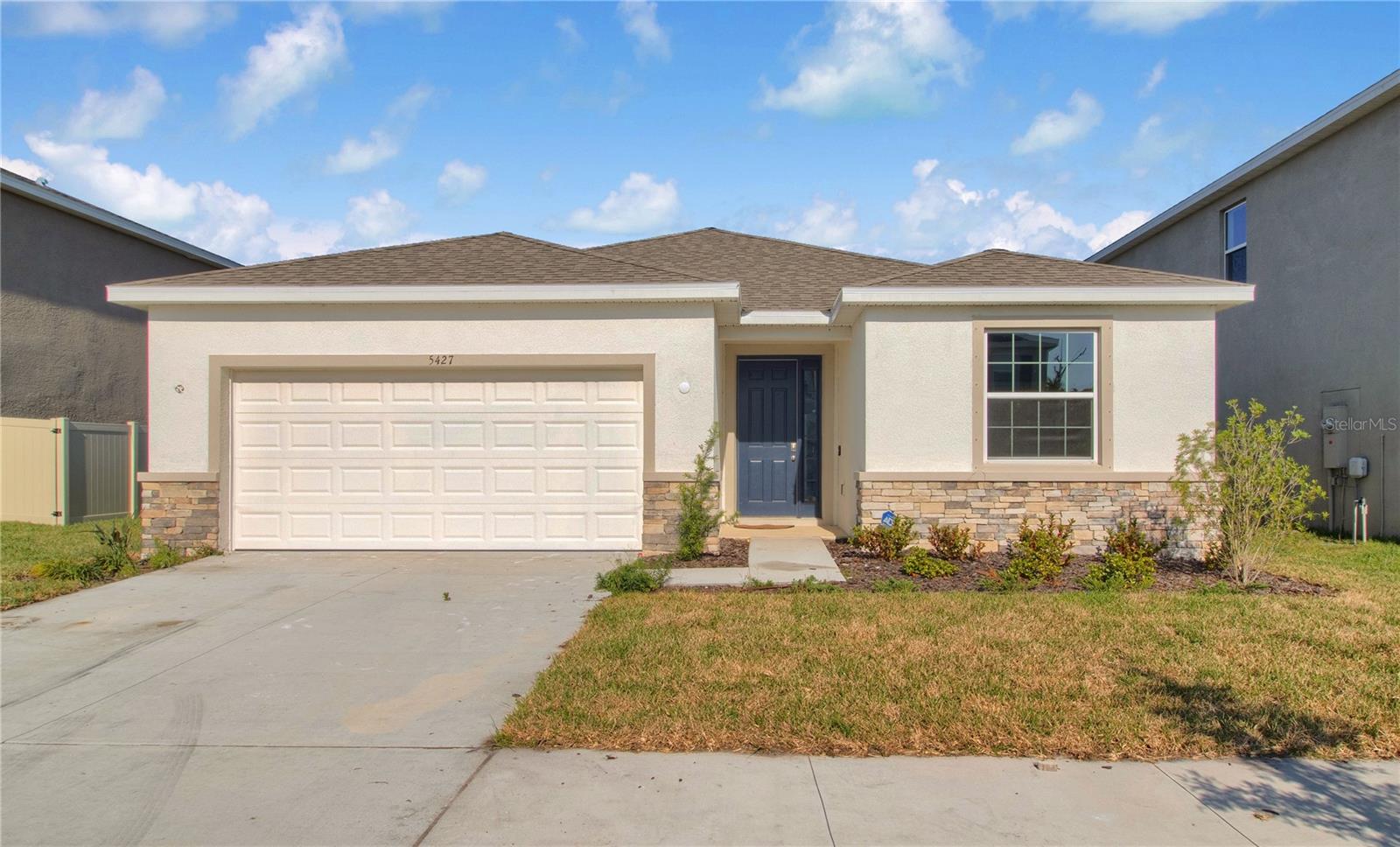 Discover this beautiful one-story home located in the desirable Creek Preserve community, just a little over one mile from the brand new Wimauma High School. The backyard offers stunning lake views, providing a serene and scenic setting for relaxation and outdoor entertaining.
Inside, the home features four comfortable bedrooms and two and a half bathrooms, all designed with style and functionality in mind. The ceiling heights are exceptional, soaring at around 10 feet in most areas and higher in the dining room and master bedroom, creating a spacious and airy atmosphere (the vast majority of houses in this community have 8-9 foot ceilings).
The bathrooms are beautifully finished with elegant stone countertops, adding a touch of luxury. The generous kitchen is a chef’s dream, equipped with a deep sink, modern appliances, and large windows that flood the space with natural light. A triple glass back door opens to the backyard, seamlessly blending indoor comfort with outdoor beauty.
This spacious, elegant home offers a perfect combination of modern design and scenic tranquility, making it an ideal place to call home.