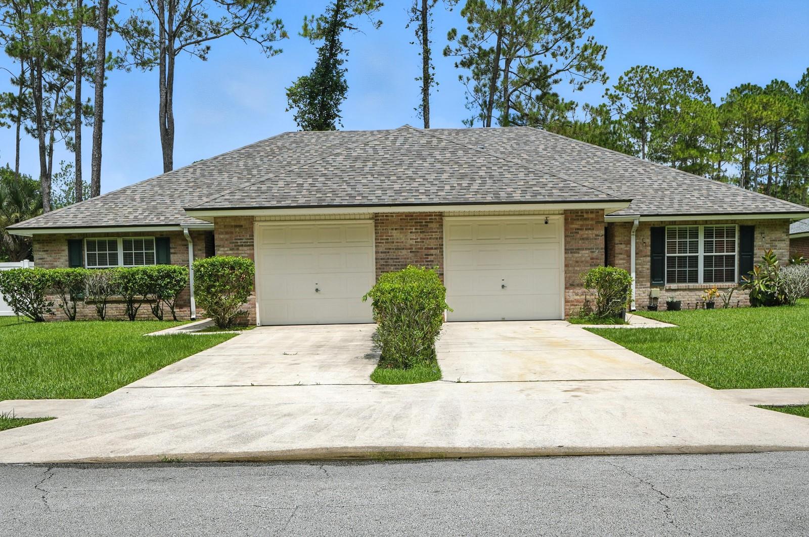 One or more photo(s) has been virtually staged. Discover the potential of this Palm Coast duplex, ideal for investment or living in one side while renting the other. Each side features vaulted ceilings, spacious layouts, and three-panel sliding doors that bring in natural light and provide easy access to the outdoor space.
Live in one side and rent out the other, or lease both for steady rental income. With separate entrances and driveways, this property is ideal for investors, multi-generational households, or buyers looking to offset their mortgage.
Conveniently located just minutes from shopping centers, restaurants, Flagler Beach, a nearby recreational park, and a walking path, this duplex offers both comfort and lifestyle. Enjoy easy access to Belle Terre Parkway and US-1 for quick commutes.
Whether you are looking to expand your real estate portfolio or secure a home with income potential, 70 Redmill Lane is a smart move.