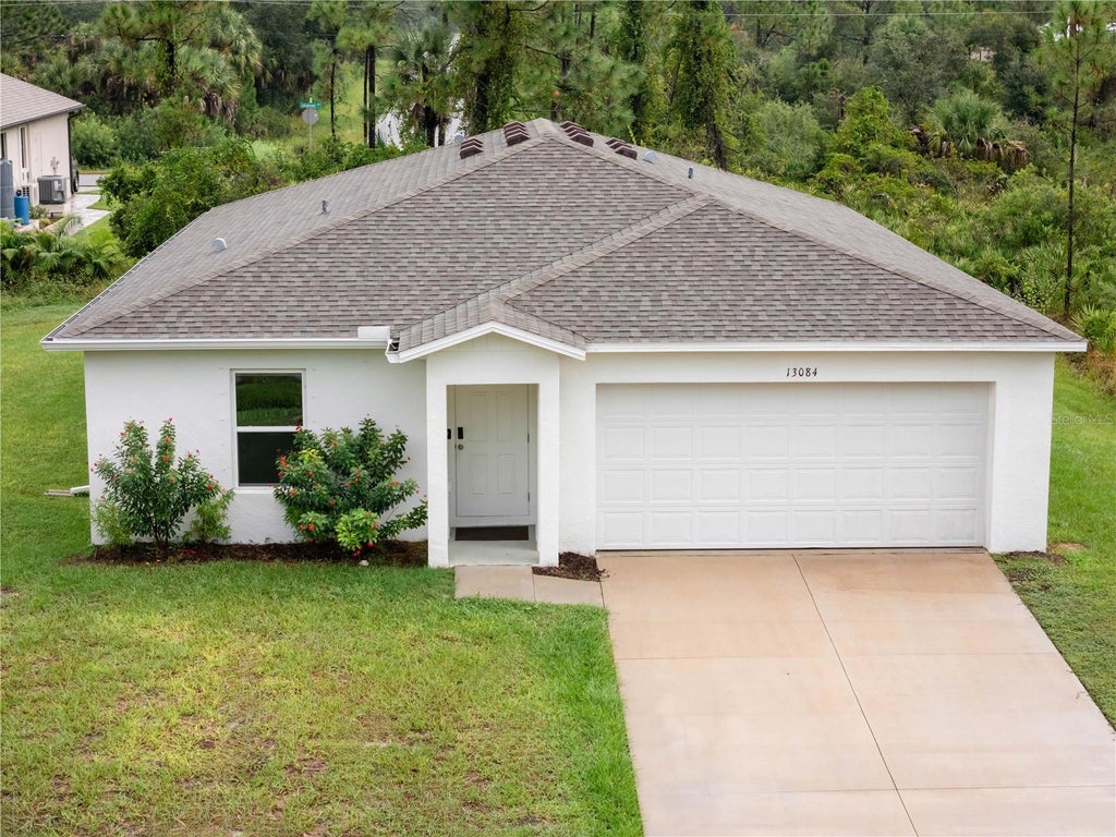 Photo of 13084 Parham Avenue, Port Charlotte, FL 33953 (MLS # C7531840)