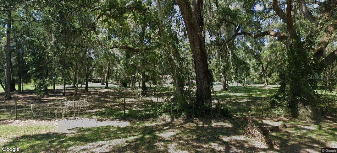 4.97 Acres Zoned R-1C with Subdivision Potential, Home + Workshop Setup!
Rare opportunity to own 4.97 acres of high-potential land on a paved, publicly maintained road in Alachua County. Zoned R-1C, this parcel offers the flexibility to subdivide (up to 4 dwelling units/acre, based on county guidelines) and build Accessory Dwelling Units (ADUs)—perfect for investors, multigenerational living, or future income opportunities. The property includes a spacious 3-bedroom, 2-bath double-wide manufactured home with 1,440 square feet of living space, featuring Hardie Plank siding for added durability and a functional split-bedroom layout. In the backyard, you'll find a 28' x 40' pole barn set up as a workshop and woodworking area. Inside the barn is a 12' x 20' enclosed workshop, already equipped with power and water, offering the ideal space for hobbies, home-based business use, or secure storage. Whether you're looking to live, build, expand, or invest—this property delivers on versatility, location, and long-term potential. Buyer to verify subdivision eligibility, density limits, and development requirements with Alachua County. Additional listing photos coming soon.