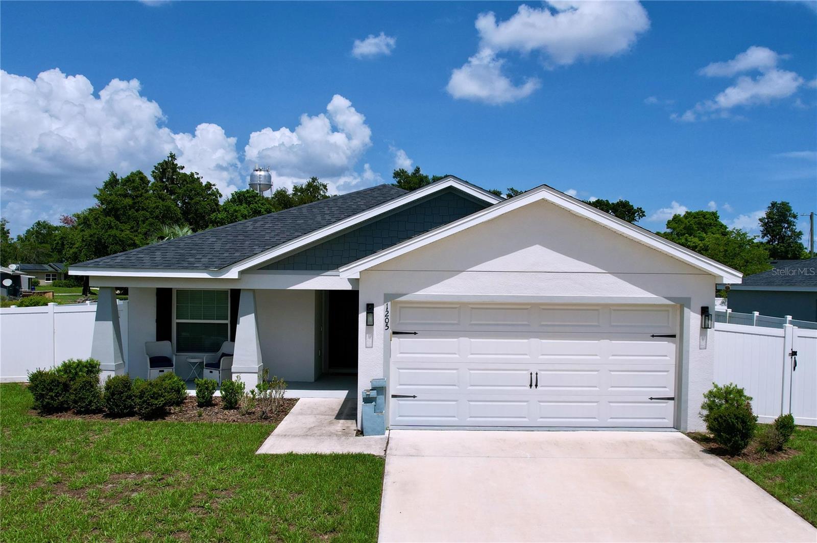 Price Adjustment….Welcome to 1205 Third Ct in Eagle Lake, Florida — a stunning 3-bedroom, 2-bathroom home built in 2021 that perfectly blends modern comfort with stylish design. This move-in ready home features soaring vaulted ceilings and luxury vinyl plank flooring throughout the main common area creating a bright and open feel. The gourmet kitchen boasts stainless steel appliances and overlooks a spacious living area, perfect for entertaining. The primary suite offers a spa-like retreat with dual vanities, a walk-in shower, and a generous walk-in closet. Relax in the luxury hot tub or enjoy the fully fenced backyard for added privacy. Additional highlights include an epoxy-coated garage floor and close proximity to Eagle Lake and Lake McLeod boat ramps, parks, Legoland, and more. Don’t miss the chance to make this beautifully maintained home yours!