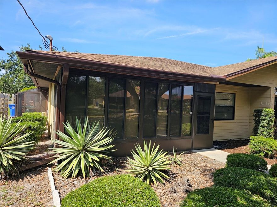 Welcome to your sunny retreat in Heritage Village West, a 55+ community designed for comfort, convenience, and connection. This spacious furnished villa offers a blend of practicality and style, with one bedroom, two full baths, and a flexible floor plan that includes a Murphy bed in the living room—perfect for overnight guests. The open great room design flows effortlessly into the dining area and a bright kitchen. Enjoy casual dining at the breakfast bar, or relax in the vinyl-enclosed front patio, complete with sun shades and screening—a peaceful place to enjoy morning coffee or a good book. The primary bedroom features a king-size bed, walk-in closet, and an en suite bath with a walk-in shower. A second full bath includes a tub/shower combo for guests. A large indoor storage room houses the washer and dryer, adding to the home’s everyday functionality. Step outside the side door to access a lovely walking path that circles the community’s perimeter. Residents also enjoy a clubhouse and heated swimming pool, perfect for year-round relaxation and social events. Conveniently located near everything you need, including the popular Anna Maria Oyster Bar just outside the entrance, and only a short drive to our stunning Gulf beaches, this villa is the perfect place to enjoy the Florida lifestyle. This home is also available for a long term lease.