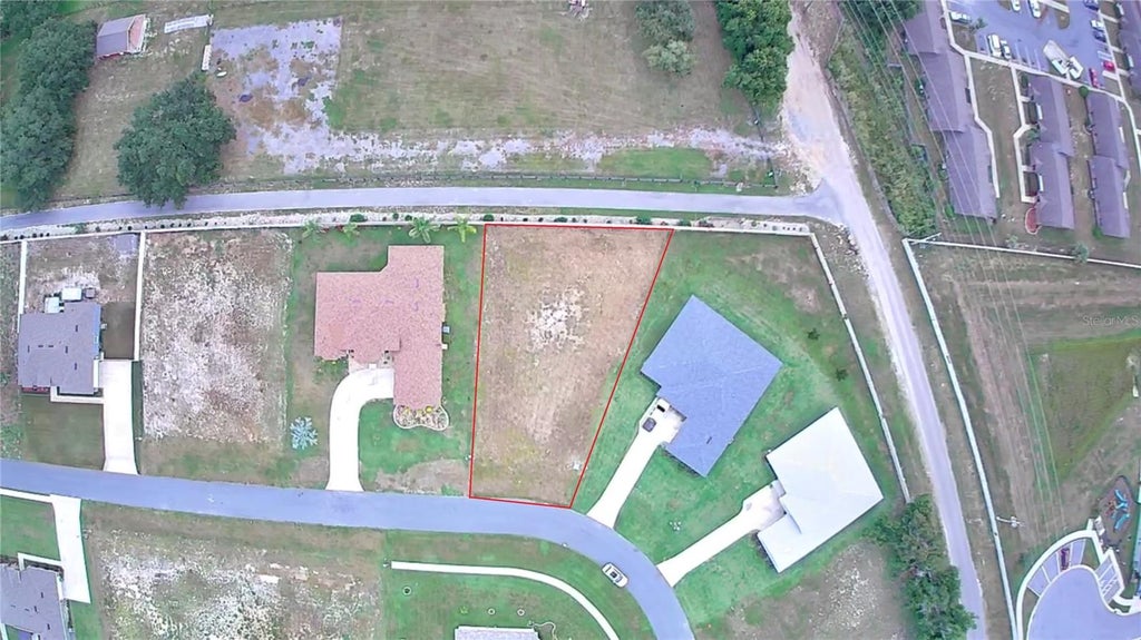 Photo of 817 Oaks Shores Road, Leesburg, FL 34748 (MLS # O6432051)