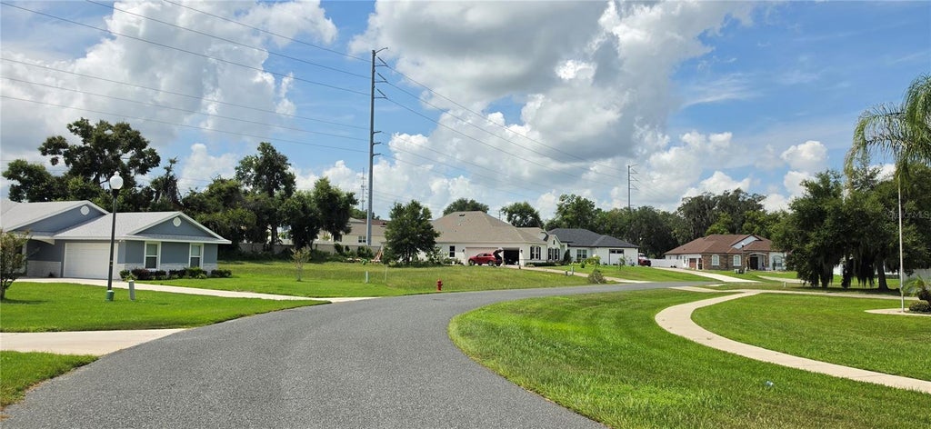 Photo of 817 Oaks Shores Road, Leesburg, FL 34748 (MLS # O6432051)