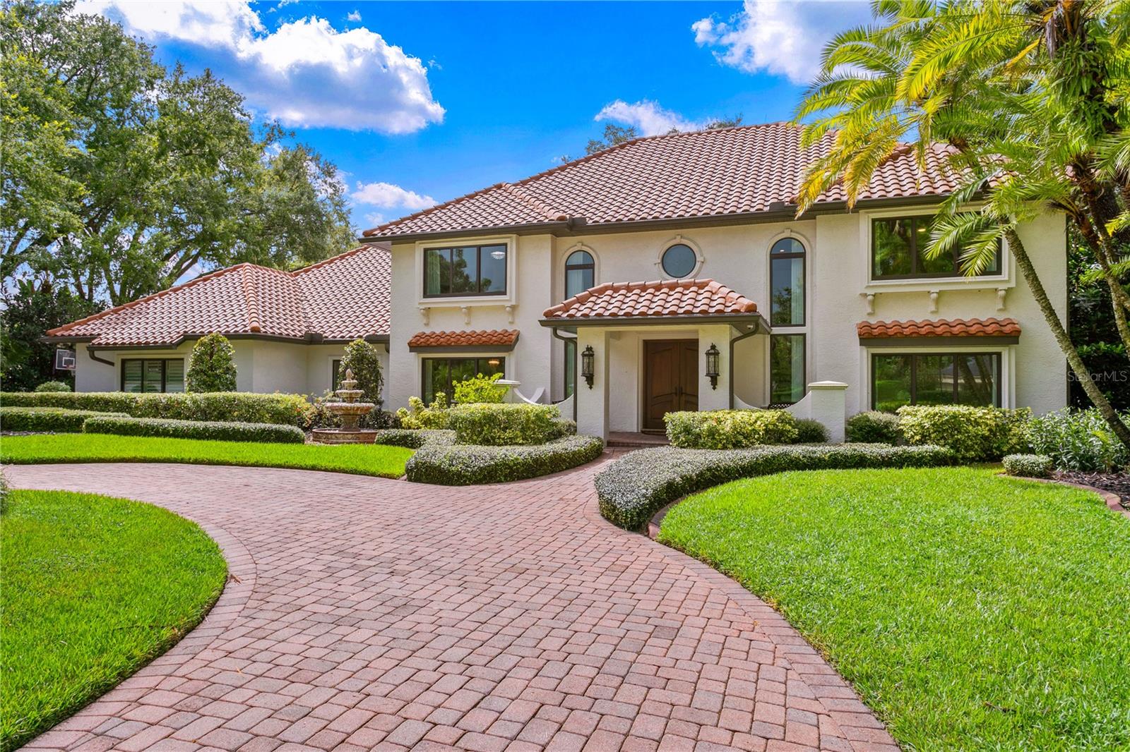 Nestled at the end of a tranquil cul-de-sac, this exquisite Mediterranean executive residence boasts over 200 feet of prime golf course frontage on one of Avila’s premier lots. Overlooking the serene 15th and 16th holes, with picturesque water views, this home is a true gem in the premier Avila Golf and Country Club community. Avila offers 24-hour guard-gated security and an unparalleled lifestyle.
As you step inside this meticulously renovated home, you are greeted by an impressive two-story foyer featuring a grand double wood and iron staircase, which elegantly divides the formal living and dining rooms. The open floor plan offers flexibility and luxury, with four en-suite bedrooms in the main home, a formal office with a full bath, an upstairs bonus area with a bath, and a separate guest suite off the lanai, overlooking the sparkling heated pool and manicured grounds. In total, the home offers seven bedrooms and seven and a half bathrooms.
Throughout the home, discover numerous luxurious features, including a chef’s gourmet kitchen complete with a gas range, Sub-Zero appliances, an island for gatherings, a walk-in pantry, and much more. The spacious family room, perfect for entertaining, features a stone fireplace, wet bar, and built-in cabinetry. Beyond the family room, a 53-foot screened lanai with limestone flooring, a wood-burning fireplace, and an outdoor kitchen invites you to enjoy the breathtaking views. Steps away, the heated pool, gazebo with heated spa, firepit, and paved path to the golf course offering endless outdoor enjoyment.
Upstairs, the owner’s suite boasts a balcony overlooking the golf course, two custom walk-in closets, and a marble bath with dual vanities, a huge walk-in shower, and a tub. Additionally, there are three other en-suite bedrooms, each offering comfort and privacy.
This home is move-in ready and impeccably maintained, with custom details throughout, including new windows and doors, crown moldings, rich wood flooring, a paved circular driveway, a whole-house generator, a fenced pet area with cool artificial turf, and balconies to take in the breathtaking views. This home is a must-see!