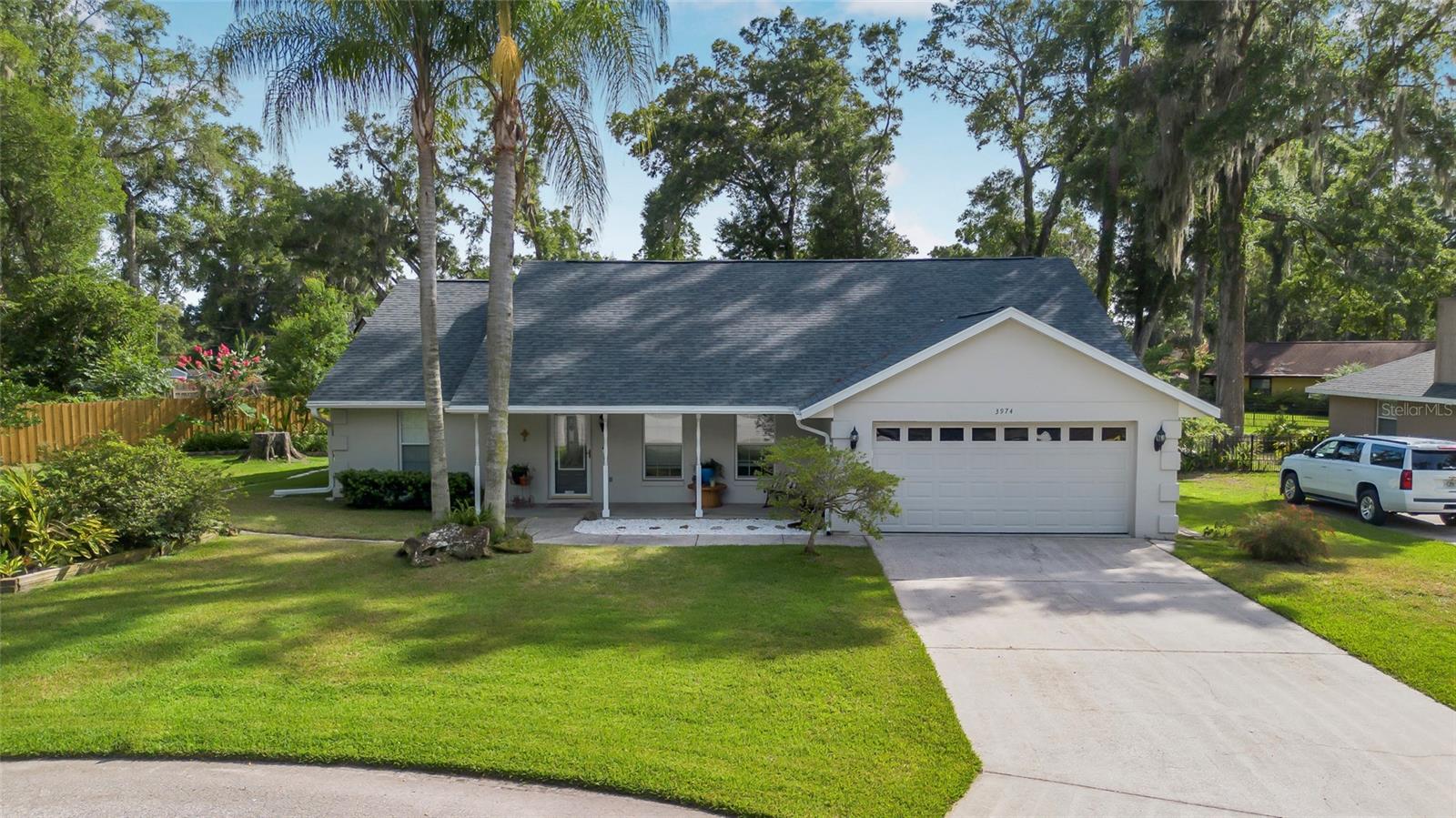 **Discover Your Dream Home** – This stunning 3-bedroom, 2-bathroom pool home features a spacious open floor plan and an inviting caged in-ground pool, making it ideal for both relaxation and entertainment. Nestled on an oversized lot with meticulously designed landscaping, this property offers a serene oasis just moments away from the city. Located on a tranquil cul-de-sac, you’ll enjoy easy access to shopping, downtown attractions, restaurants, and vibrant entertainment options. The energy-efficient double-pane windows enhance comfort year-round, while the roof, replaced in 2021, ensures peace of mind. Plus, the pool cage has recently been rescreened for your enjoyment. This home is truly ready for you to move in and make your own!