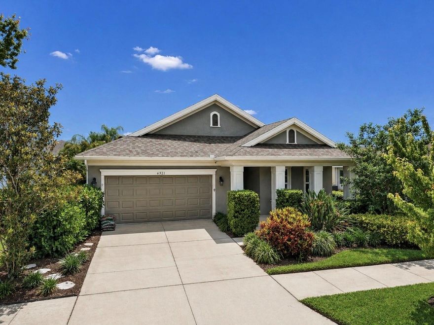 6921 Ebb Tide Ave, Apollo Beach, FL 33572 | 4 Bedrooms | 2 Bathrooms | 2,114 Sq Ft | 2-Car Garage | Saltwater Pool Home | Waterset

Highly upgraded and extensively customized, this Waterset pool home brings together modern design, smart functionality, and outdoor living in a way that’s hard to replicate. From the moment you walk in, the attention to detail stands out with wood plank tile flooring throughout the main living areas, crown molding, chair rails, LED recessed lighting, framed sliding glass doors, plantation shutters, and designer architectural wall features throughout the bedrooms. The open split-bedroom floorplan offers privacy and flow, while built-in carpentry in the dining room and office adds both character and function. Every room is hardwired for internet, and the home is equipped with two security systems, whole-house surge protection, and Category 5 rated hurricane impact windows.

The gourmet kitchen was designed to be both a centerpiece and workspace, featuring stainless steel appliances, built-in oven and microwave, gas cooktop with exhaust hood, French door refrigerator, 42” upper cabinets with crown molding and under-cabinet lighting, tile backsplash with under-island detailing, oversized island with breakfast bar seating, walk-in pantry, and professionally painted cabinetry. It all opens directly into the living and dining spaces, making the home feel connected and easy to live in.

The primary suite is privately positioned and finished with a custom shiplap feature wall, luxury vinyl plank flooring, room-darkening shades, and two walk-in closets with built-in organizers and shelving. The ensuite bath includes dual split vanities with framed mirrors, an oversized frameless glass shower with tile to the ceiling, built-in bench, niche, and listello accents. Secondary bedrooms continue the custom feel with upgraded wall detailing and designer finishes throughout.

The outdoor living space truly separates this home. Step through the sliding glass doors to a covered and screened lanai complete with a stone feature wall, electric fireplace, ceiling fans, TV mount, privacy shade, and a full outdoor kitchen overlooking the saltwater, solar-heated pool. The pool area features a non-slip epoxy deck, while outside the enclosure is a fenced backyard with privacy landscaping, pavered walkway with fire pit, and professionally installed permanent Trimlight lighting for holidays and events.

The garage includes two overhead storage racks, smart app-controlled opener, newer water heater (2023), and upgraded water softener (2025). The laundry room offers upper and lower cabinetry with a utility sink.

Waterset is known for its resort-style amenity centers, pools, splash pads, fitness centers, parks, walking trails, restaurants, and highly rated public and charter schools. Apollo Beach offers the Nature Preserve, Manatee Viewing Center, marinas, and a connected coastal lifestyle. Conveniently located near US Hwy 41, US 301, and I-75 with quick access to Tampa, St. Petersburg, Sarasota, MacDill Air Force Base, three international airports, major sports venues, concerts, the Hard Rock Casino, hospitals including the VA Medical Center, and Gulf Coast beaches.