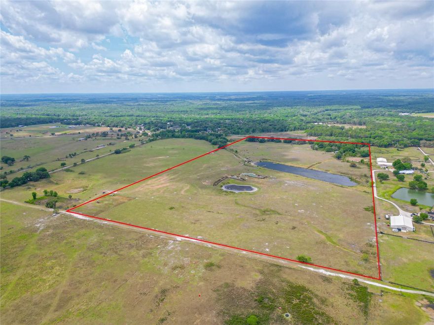 79 Acres (including a large, stocked fishing pond!) leaves plenty of space for you to build your dream home, let your cattle roam, or build a family property and split into multiple parcels! Truly unique in the Florida way, this parcel boasts beautiful Oak trees and an elevation that changes from low to high. With a beautiful high spot to put your home and look over your land with pride! There is both a front gated entry and back gate entry off of the shared road (NW 44th Ave.) 

Parcel is able to be divided into minimum 10-acre parcels per the county. Any subdividing will possibly need a planned access road.  

Additional Parcel for sale as well Paracel ID E23-048 (51 acres) MLS ID G5067232

Please do not enter the property without your realtor and an appointment.