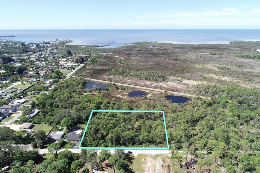 Prime 2.1-acre parcel in Hudson with fully paved road frontage and approved simple subdivide potential—split into two 1-acre homesites or keep it whole for a private estate. Zoned R-1MH-100 (single-family or mobile homes) with RES-6 future land use, allowing multiple build options: one large SFR retreat, two new builds, or even a duplex with county approval. City water available (quote on file), septic feasible, and completed wetland delineation report and flood data included. Level, accessible, and ready for your vision. No HOA, electric at the street, and minutes to US-19, shopping, and the Gulf. Endless possibilities.