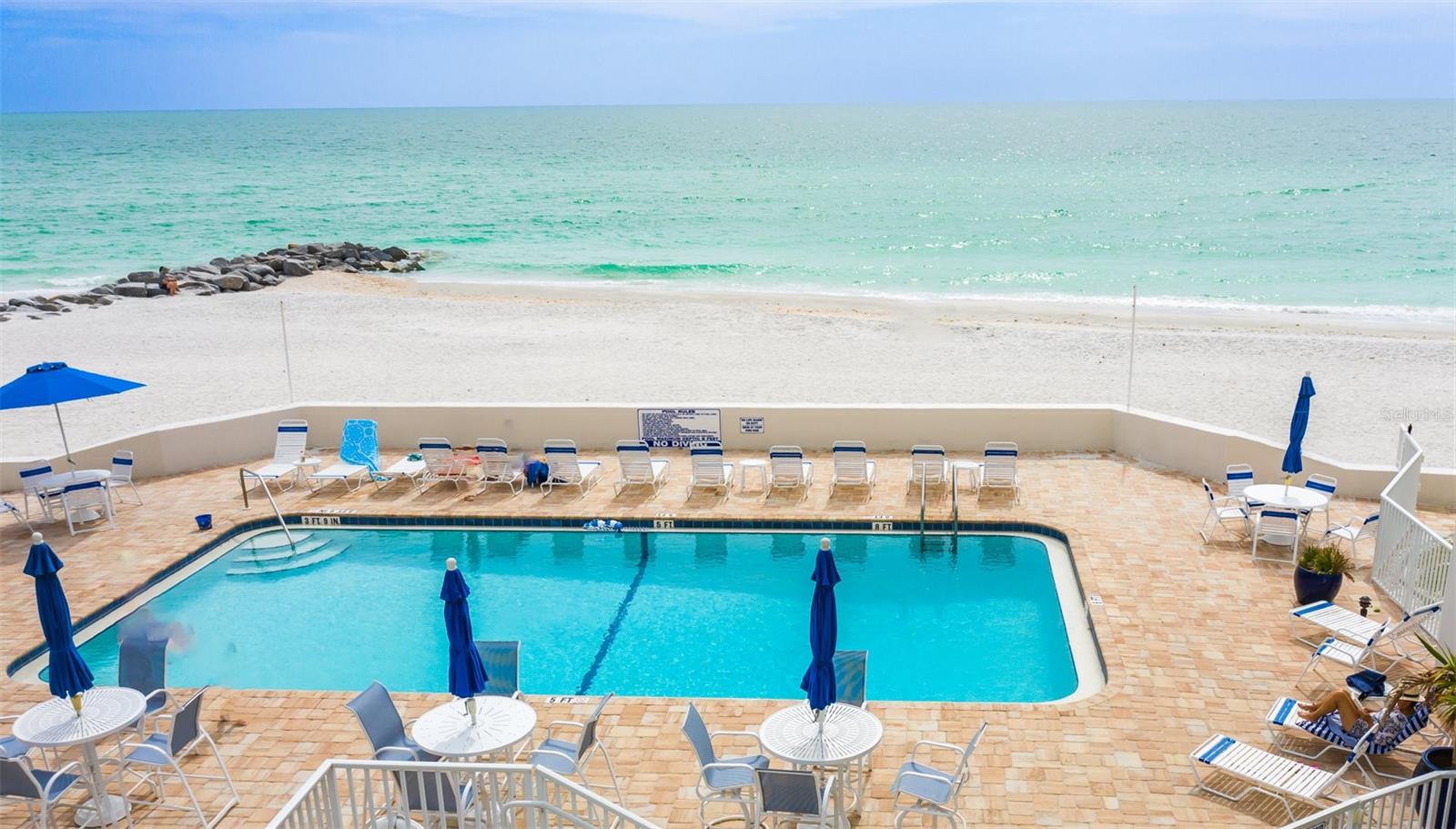 COMPLETELY RENNOVATED FROM TOP TO BOTTOM LIDO BEACH CONDO. EVERY LUXURY UPGRADE HERE. NEW PLUMBING, NEW ELECTRIC, NEW HIGH CEILINGS, NEW AC, NEW WATER HEATER, NEW FLOORS, TOP LINE TOP KNOTCH NEW KITCHEN, NEW LAUNDRY. No elevators, no stairs.. just park in your covered, attached spot, and walk into your one story slice of paradise. Want walkability? This is it! St. Armand's is just a stroll. Available starting NOW! Villa is exception value for the luxury and location. Fly throughs of property are available. Let's get the conversation going! NEW PHOTOS COMING OF THE LUX UPGRADES!!! THIS IS AN ANNUAL UNFURNISHED RENTAL.