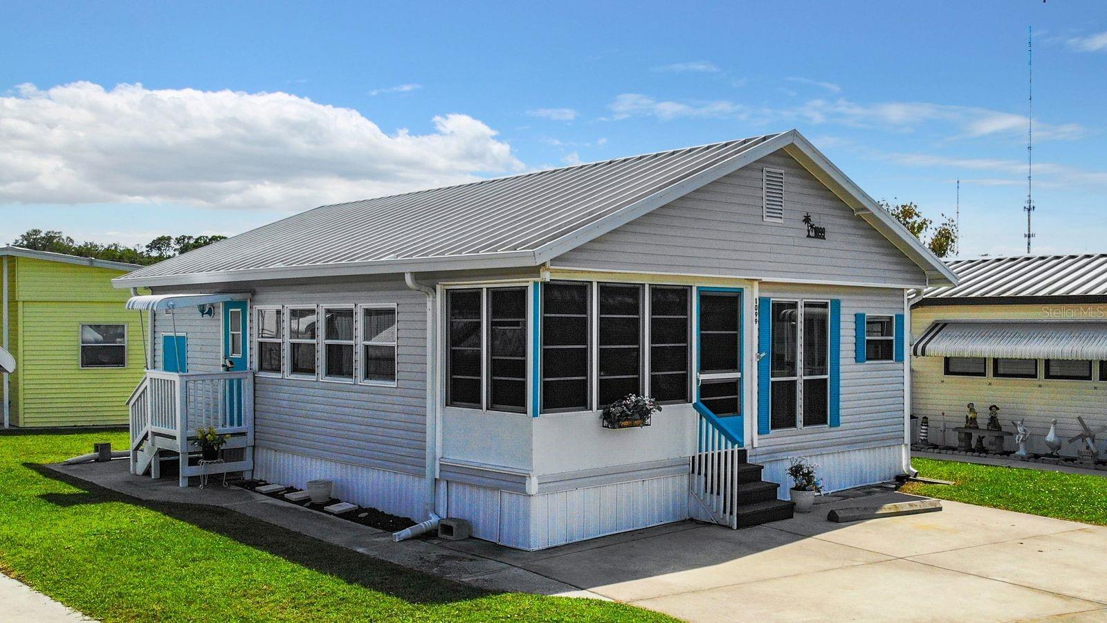 OFFERS WELCOME ON THIS CHEEFUL MOBILE HOME IN ACTIVE 55+ COMMUNITY! So much to offer in this FURNISHED one bedroom, 1.5 bath home. Beach vibe & decor throughout. Relax on the enclosed front porch or in the comfortable living room. The large closet off the living room provides extra storage. Off the dining room is the primary suite with full bathroom and extra storage cupboards. There is a stacker washer/dryer unit in the half bath. All appliances included! Central a/c, metal roofover, room to park two vehicles, and a 48 sq ft storage shed help make this home easy to live in. Sold for CASH ONLY. Sugar Creek Country Club has LOW HOA FEES OF $525 PER QUARTER which include internet, cable, grass mowing, water, sewer and trash. There are 2 swimming pools, heated spa, clubhouse, tennis, pickleball, shuffleboard, a fitness room, and workshop. There is an active social calendar during the winter months. Sorry, this is not a dog lot.