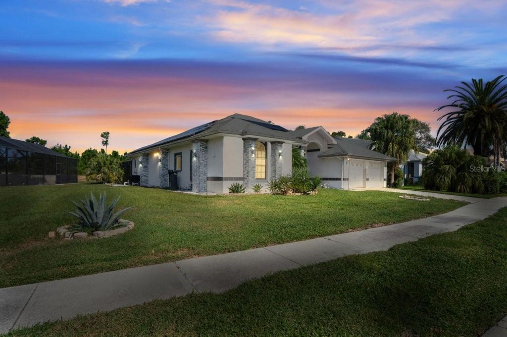 Photo of 9301 Tournament Drive, Hudson, FL 34667 (MLS # W7879026)