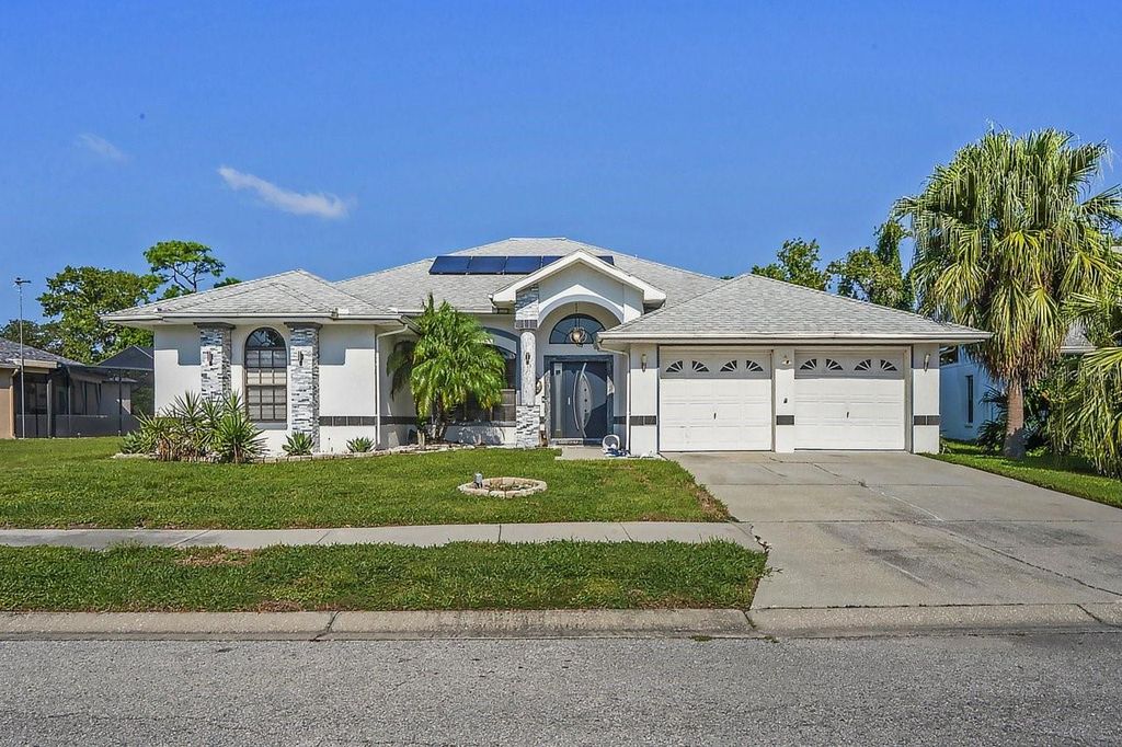 Photo of 9301 Tournament Drive, Hudson, FL 34667 (MLS # W7879026)