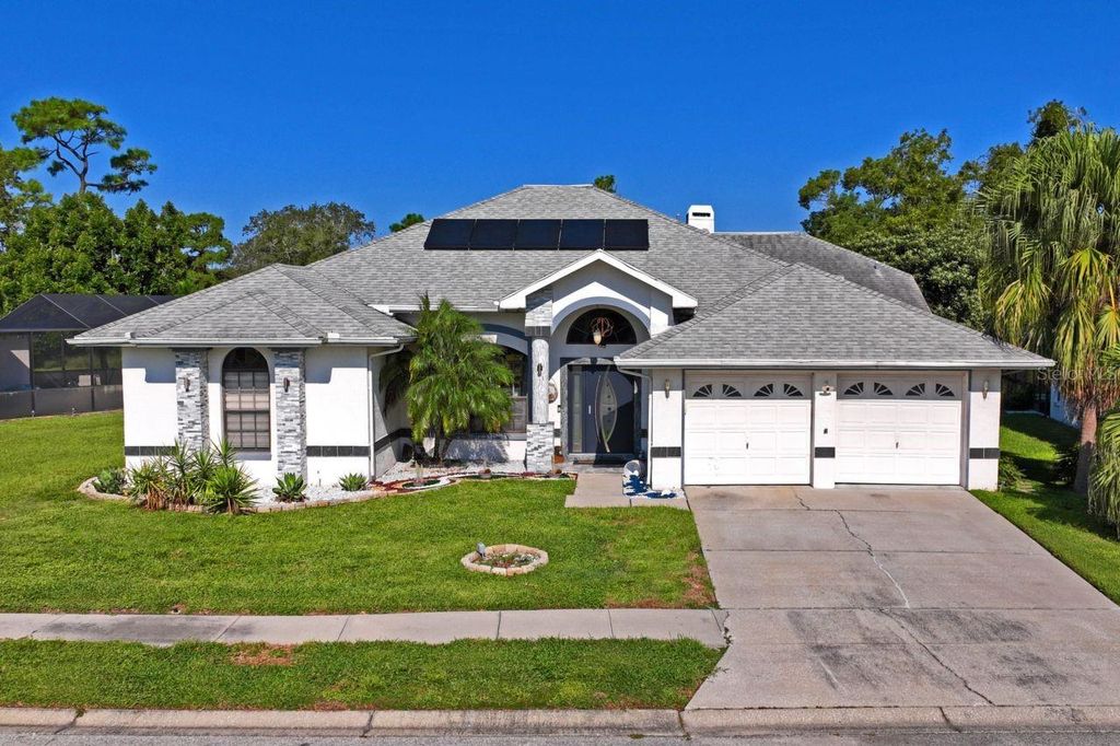 Photo of 9301 Tournament Drive, Hudson, FL 34667 (MLS # W7879026)