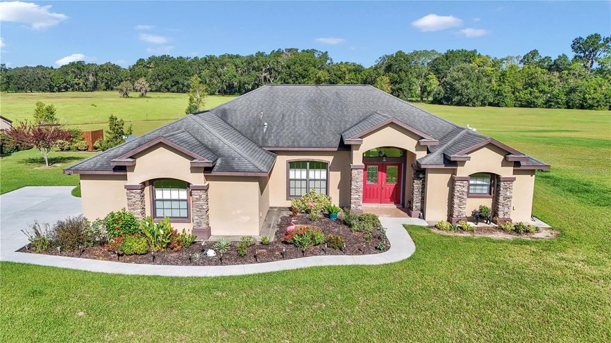 Check out this ABSOLUTELY STUNNING HOME. Nicely situated on over 5 1/2 acres and in excellent condition ready for your horses with A1 zoning. The home has an open floor plan with high ceilings, lots of cabinet space, beveled edge counter tops, spacious kitchen and large pantry. The home also boasts tile floors through out, formal dining area, formal living area, breakfast nook and eat in bar. Master bedroom and great room have custom tray ceilings. There are many other upgrades that make this home a must see! Outside the home you will find a 45x30 3 bay concreted floor barn  w/electric that has a workshop and is partially insulated. Behind that is a 32x12 finished storage shed that would be perfect for a tack room or motherinlaw suite. Property is fully fenced and is ready for cross-fencing for horse paddocks. Garage floor, back patio/porch and front side walk have just been covered with polyurea coating.The home is conveniently located between Ocala and Gainesville and 30 minutes from the World Equestrian Center.