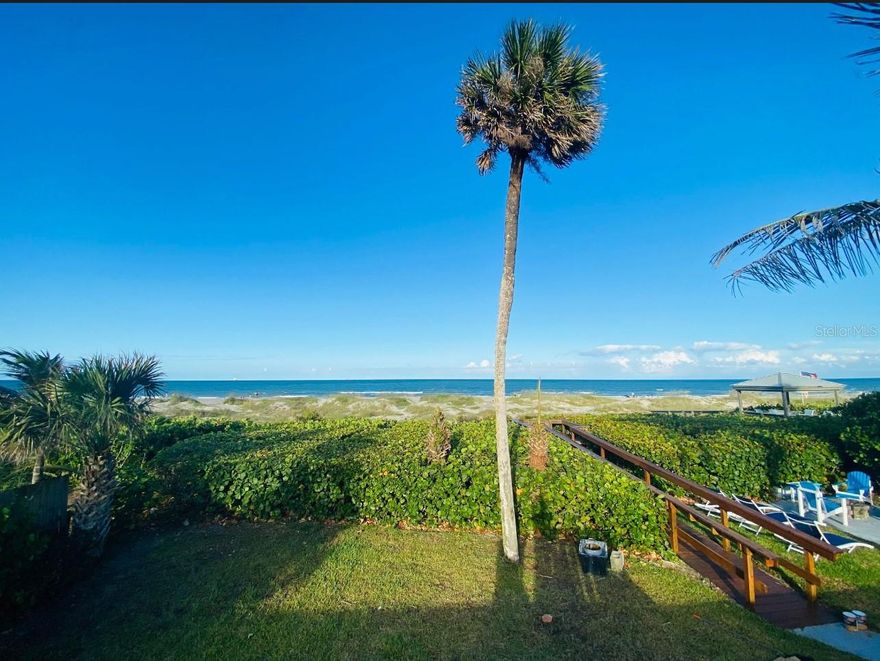 Back on the market. Priced to sell. This is the canvas you are looking for. Perfect vacation home, 2nd home or possible short term rental. Waik out your back door, straight to the water. This quaint mid-century modern design sits oceanfront in the heart of Cocoa Beach w/private beach access & w/in walking distance to charming fare. Beautiful exposed wood-beamed ceilings & big picture windows accent a bright living rm, as an enclosed sun porch overlooks leafy dunes, a spacious fenced backyard & 2 open-air patios. The quartz kitchen displays a SS fridge, wall oven, subway tile backsplash & leads into elegant dining. Plantation shutters, a walk-in closet, dual-sink quartz vanity, tiled shower & a sitting rm/office make up a comfortable owner's retreat. A small attached bdrm. offers exterior access & entry to the 2nd bath, which flows into the 3rd bdrm & hallway. Across the home, French doors open to the 4th bdrm & shower ensuite, a space exhibiting calm oceanward views.