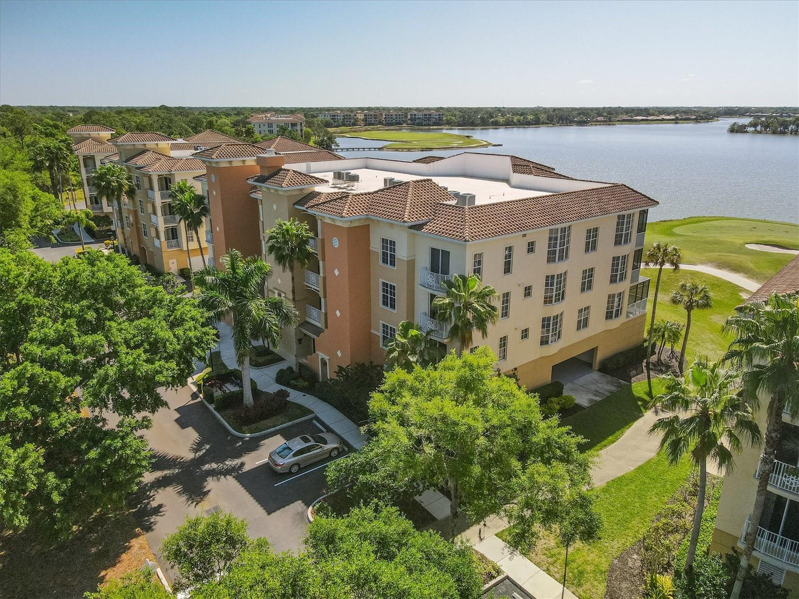 ONE OF THE BEST VIEWS IN WATERCREST! LAKEFRONT, CLEAN Three bedroom, Three bath, Two car enclosed garage, third floor END UNIT with a stunning view of Lake and Golf Course. FURNISHING'S OPTIONAL Sought after Mirabel floor plan in Watercrest is poised in the middle of Lakewood Ranch overlooking 160 acre Lake Uihlein. Few minutes walk to Lakewood Main street with restaurants, boutiques, and more! Furnishings optional, and 1 year home warranty provided. This unit has one of the best views to enjoy from your Living Area, Primary Bedroom, and Large Screened/Covered Lanai! Large wall to wall sliding doors to fully enjoy the AMAZING view of the Lake! Primary Bedroom also has access to the Lanai, ensuite Bath with soaker tub, separate shower, and dual sinks, with two large walk-in closets. Kitchen is spacious featuring tall wooden cabinetry, granite counters, and a breakfast bar integrated with the dining area, and Great Room open floor plan. Being an end unit there are three large windows in the living area and LOTS of light. Guest bedrooms each have en-suite bathrooms! Bath #2 tub/shower combination, and Bath #3 has a stand up shower, and the 3rd bedroom has its own private juliette balcony! Laundry Room room is off the Hallway featuring a utility closet, full size washer & dryer, sink, and built in ironing board. Lakewood Ranch, is an award winning Master Planned community, has glorious weather, and a perfect location to all. Inland, and safe during storms. Golf Courses, world renowned Siesta, Lido, & Longboat Key, and Anna Maria Island Beaches, Boating, Fishing, Biking, walking trails, etc ...hobbies you can enjoy year round! Short drive to UTC Mall and numerous restaurants. Downtown Sarasota, a jewel of a city with Hip chic vibe, wonderful restaurants...Historic Bradenton, more wonderful restaurants and rooftop bars, and cultural venues to explore. Several international airports within an hour drive or less. Welcome to the Gulf Coast of Florida, a lifestyle second to none!